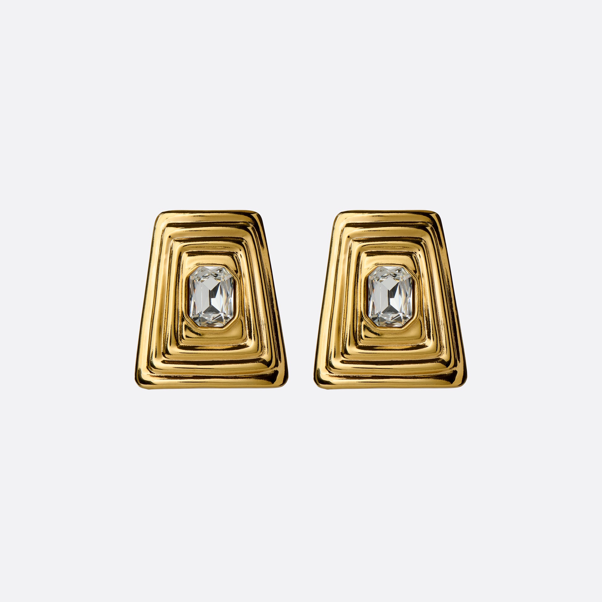 Gold-tone metal clip-on earrings with a central crystal detail.