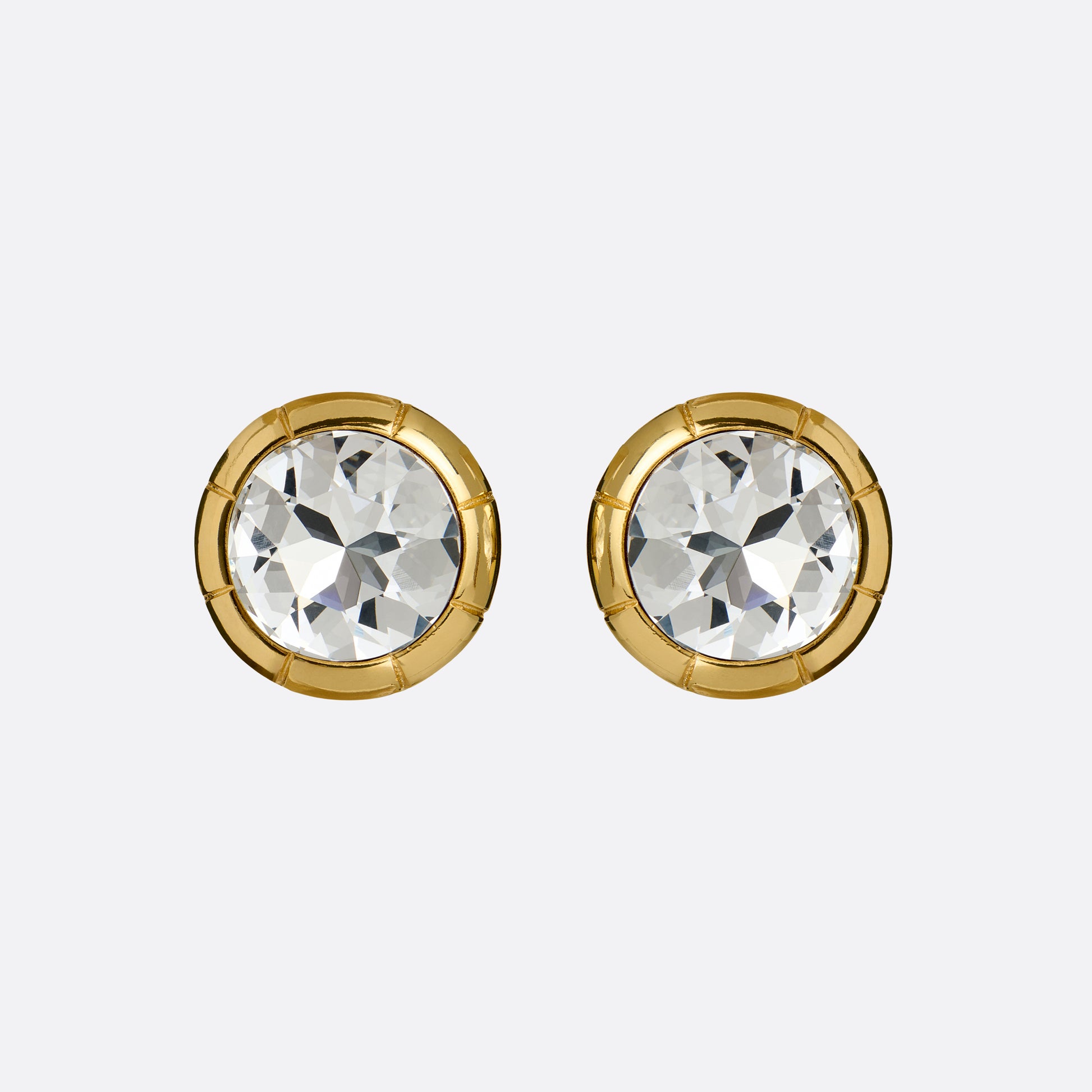 Gold-tone metal clip-on earrings with a round crystal.

Featured in the Fall Winter 2026 Lookbook.