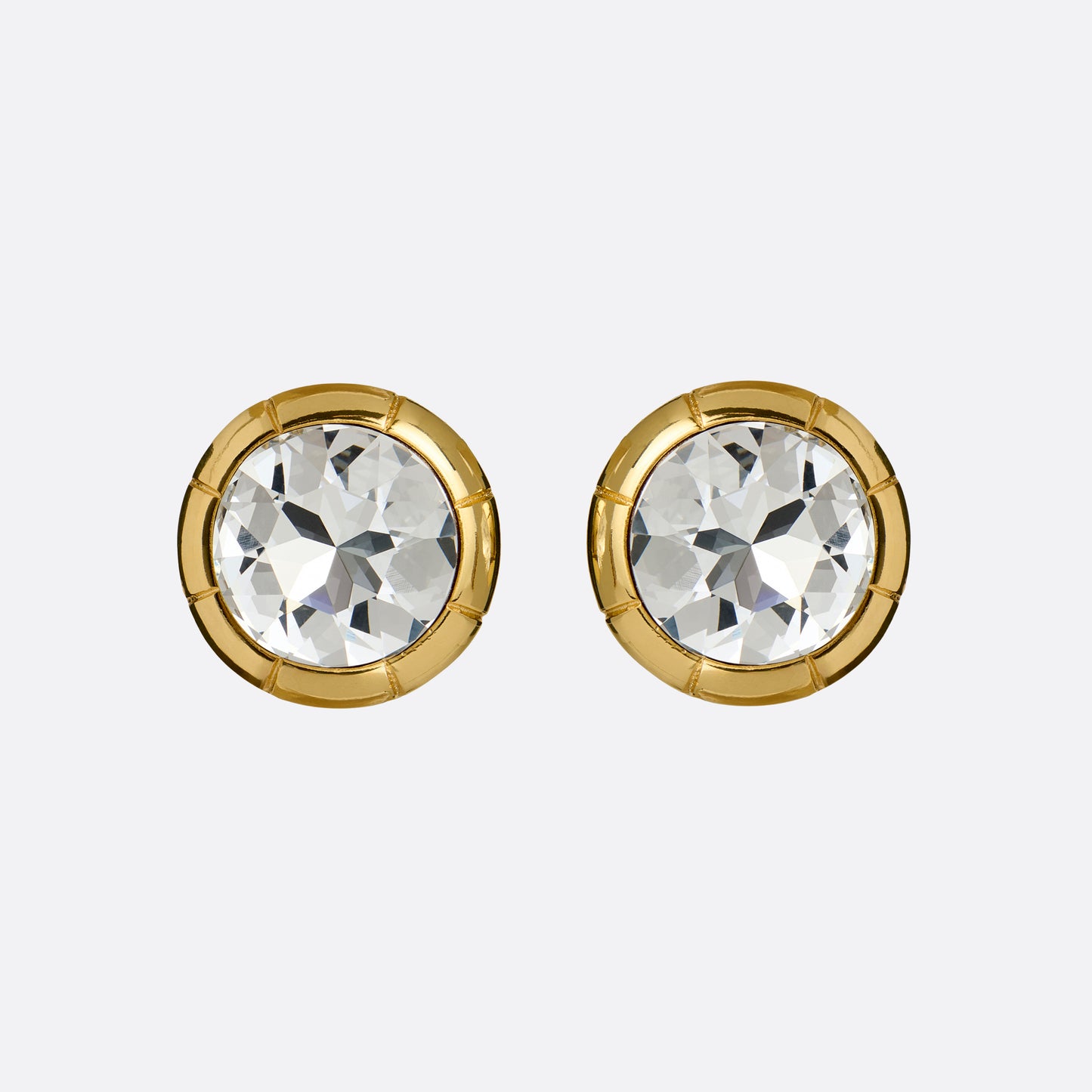Gold-tone metal clip-on earrings with a round crystal.

Featured in the Fall Winter 2026 Lookbook.