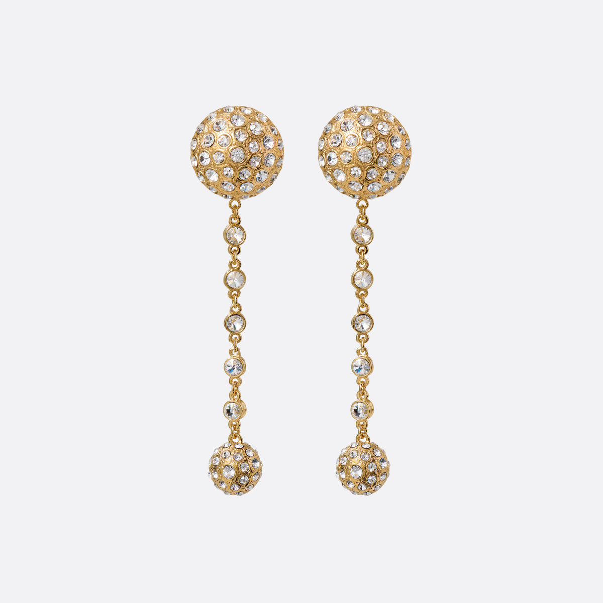 Gold-tone metal drop earrings with crystal-embellished round studs, featuring spherical pendants and a crystal chain.