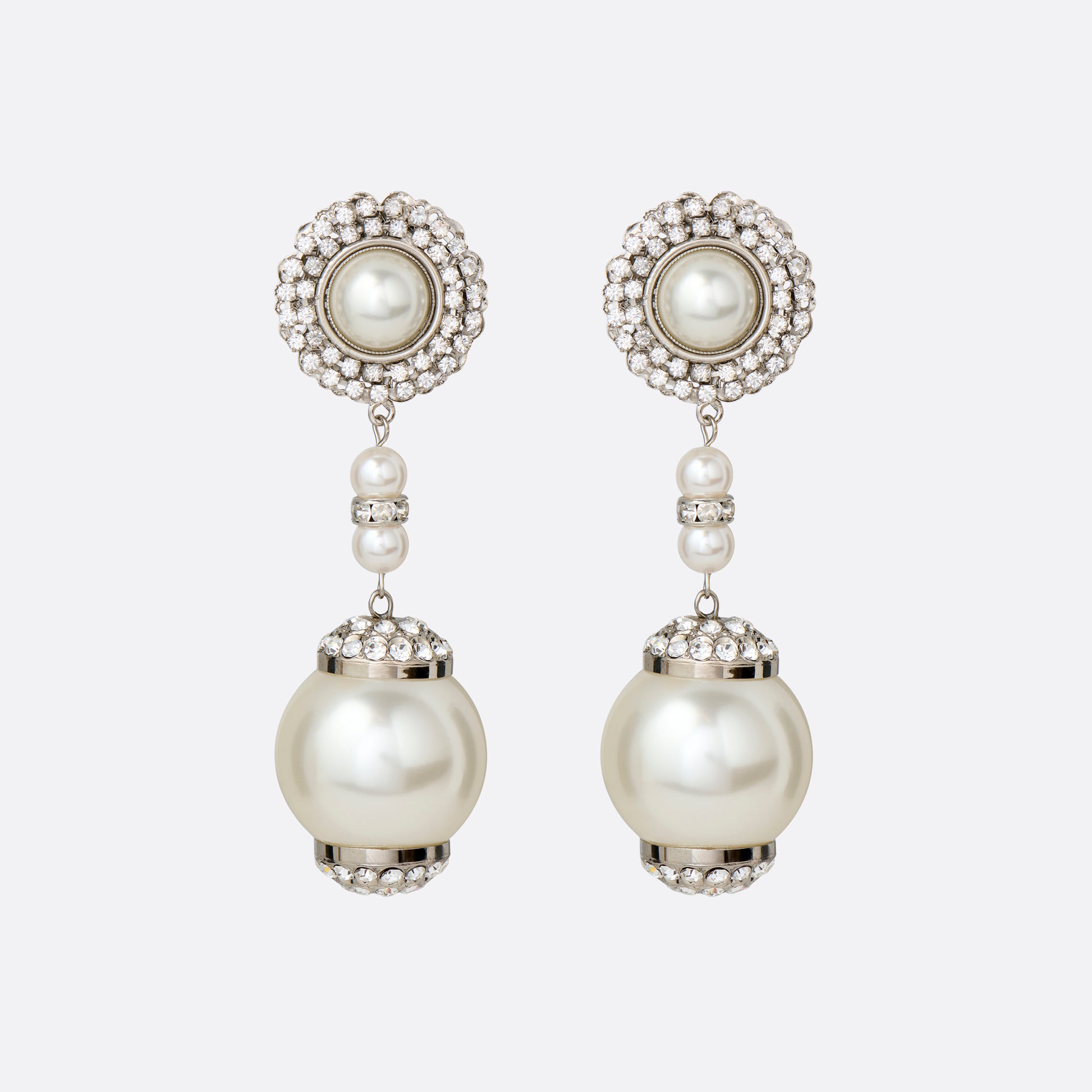 Silver-tone metal clip-on earrings with pearl and crystal details and a pendant drop.

Featured in the Fall Winter 2026 Lookbook.