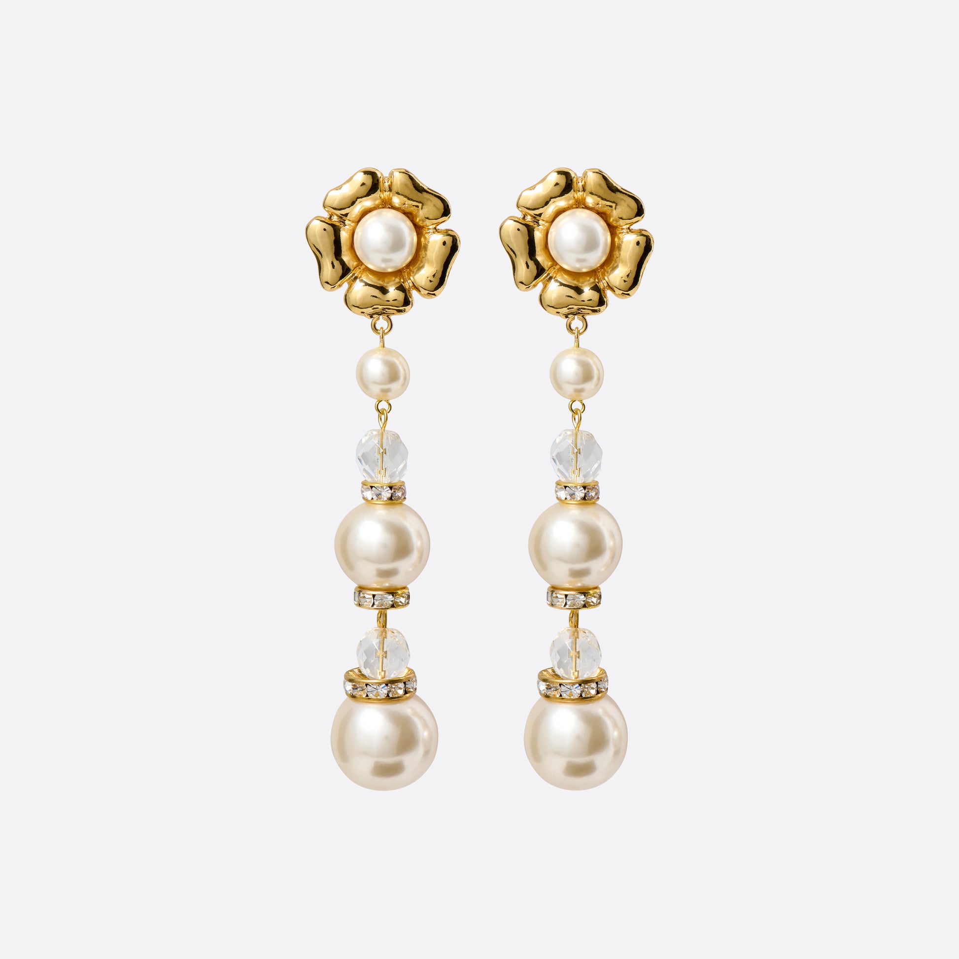 Gold-tone metal clip-on earrings with floral elements and a pearl and crystal pendant drop.

Featured in the Fall Winter 2026 Lookbook.