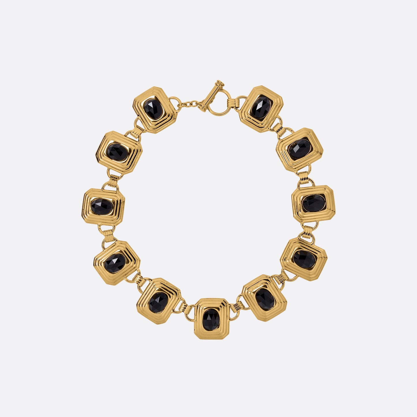 Gold-tone metal necklace composed of geometric links set with black crystals. Finished with a t-bar clasp.

Featured in the Fall Winter 2026 Lookbook.
