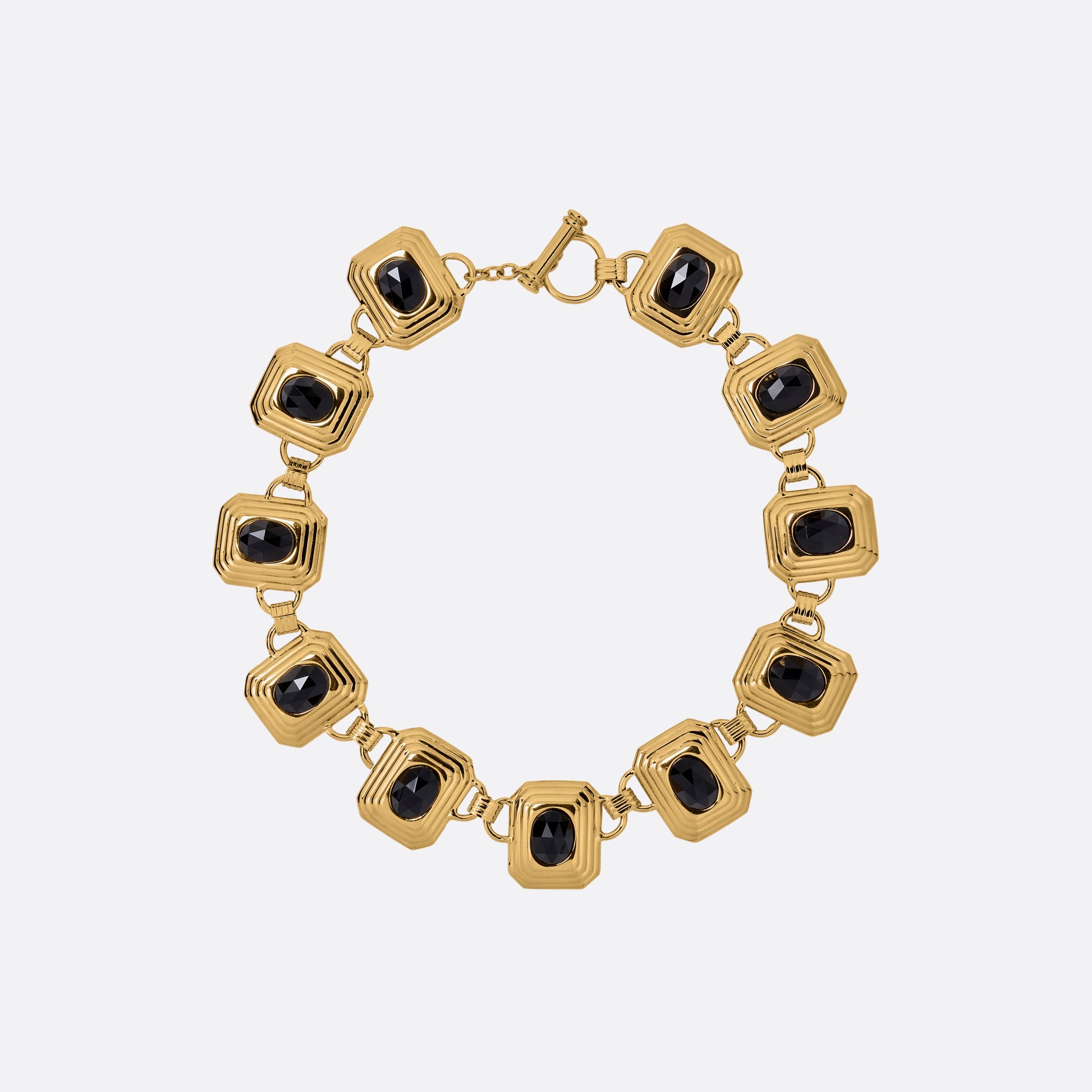 Gold-tone metal necklace composed of geometric links set with black crystals. Finished with a t-bar clasp.

Featured in the Fall Winter 2026 Lookbook.