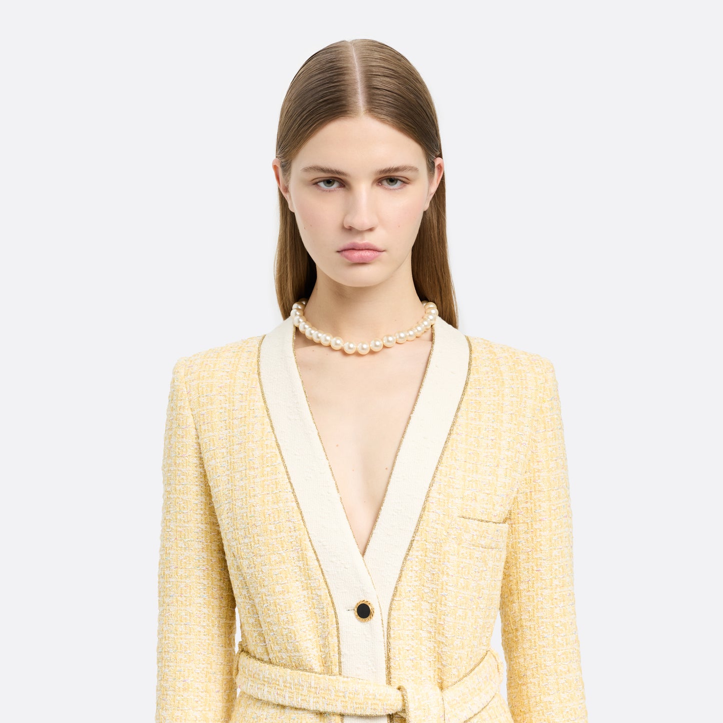 Pearl necklace finished with a crystal-embellished clasp in gold-tone metal.

Featured in the Fall Winter 2026 Lookbook.