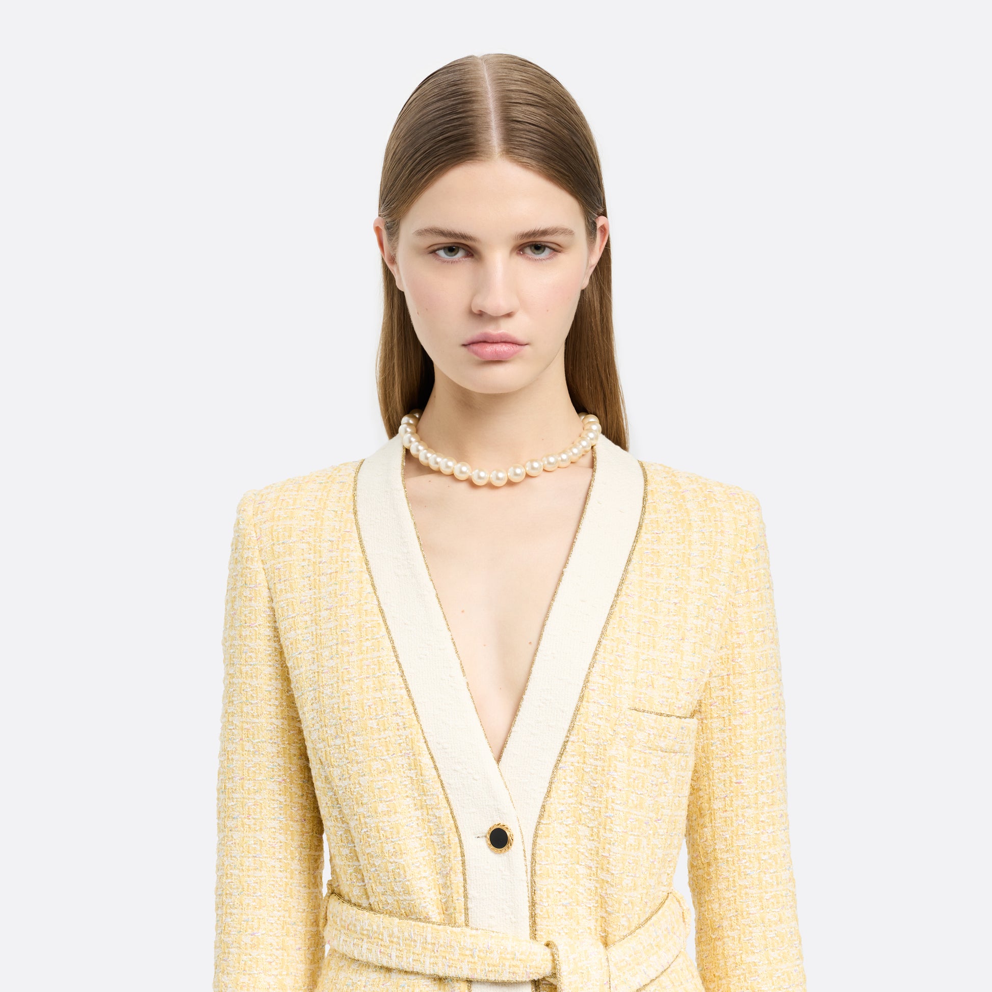 Pearl necklace finished with a crystal-embellished clasp in gold-tone metal.

Featured in the Fall Winter 2026 Lookbook.