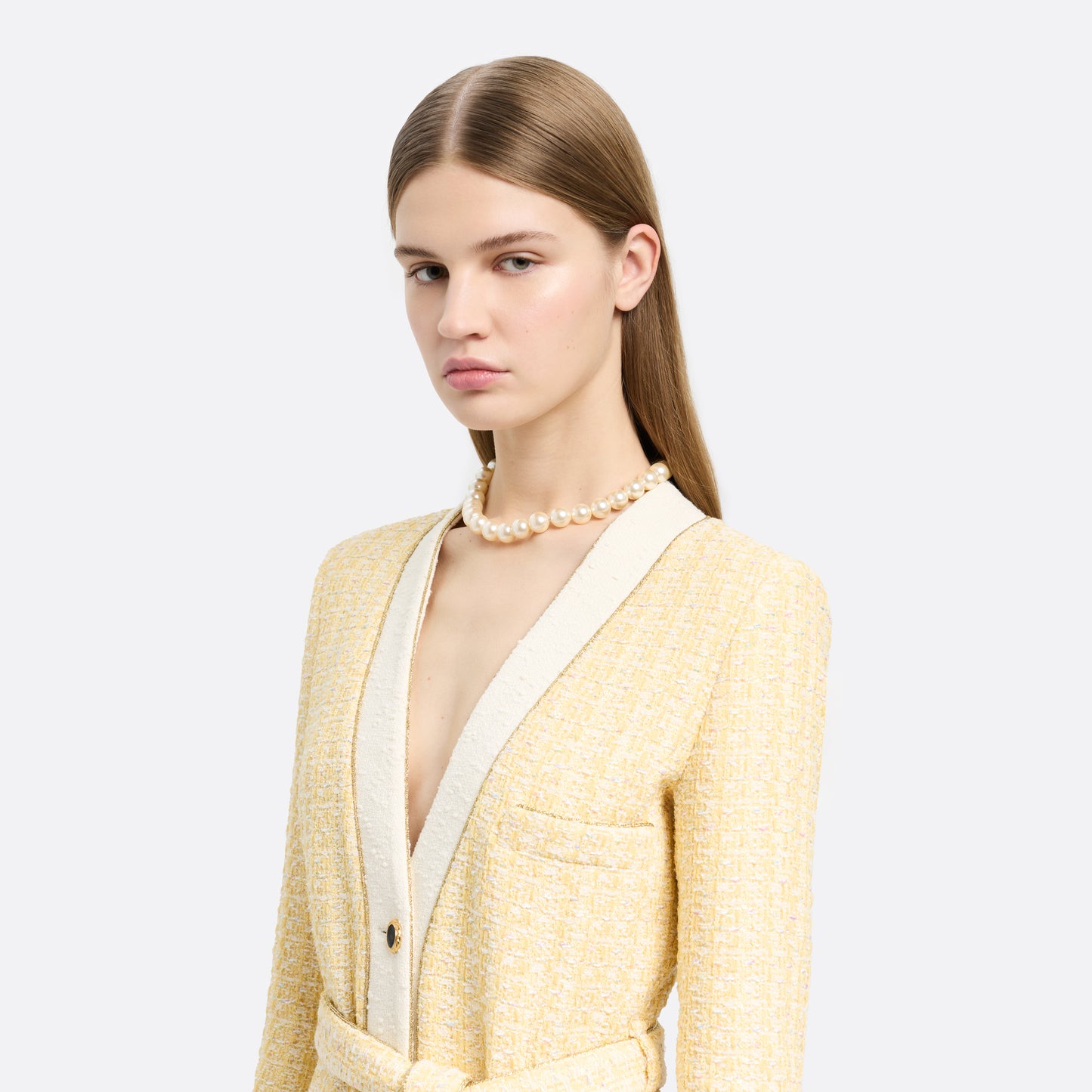 Pearl necklace finished with a crystal-embellished clasp in gold-tone metal.

Featured in the Fall Winter 2026 Lookbook.