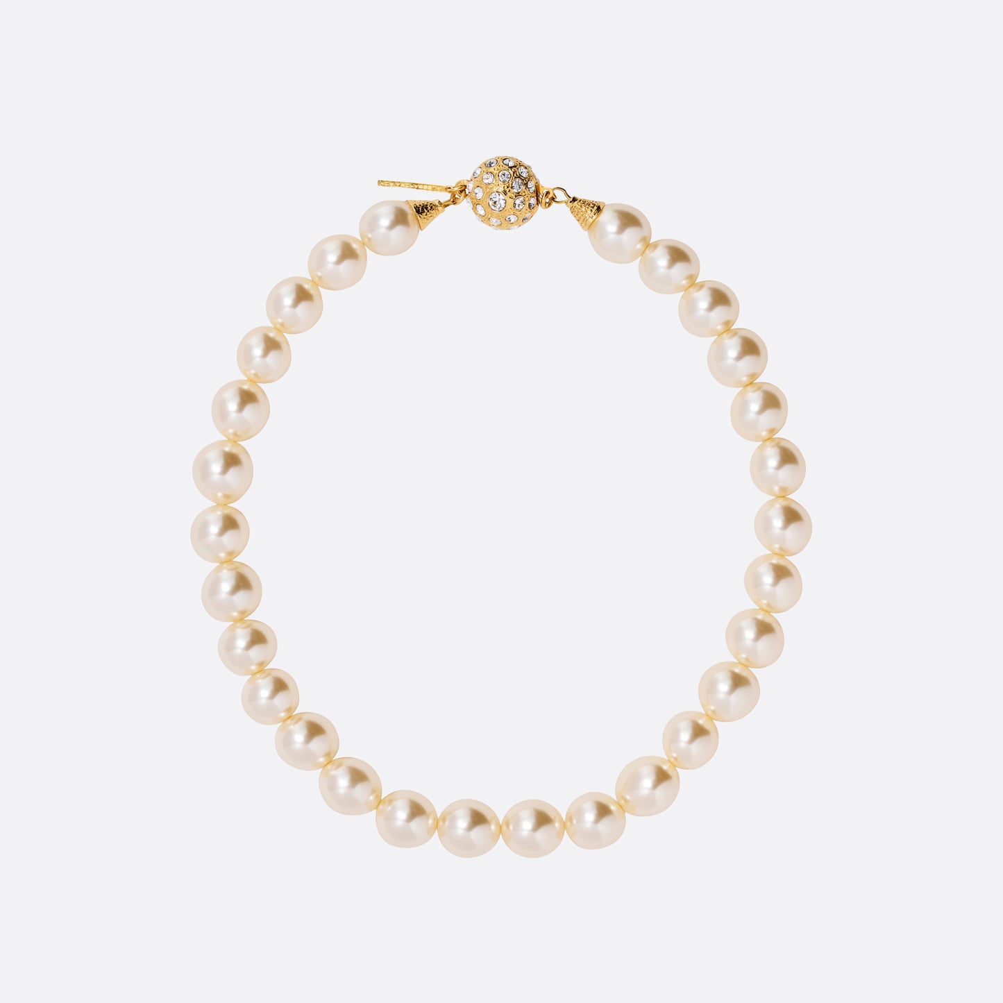 Pearl necklace finished with a crystal-embellished clasp in gold-tone metal.

Featured in the Fall Winter 2026 Lookbook.