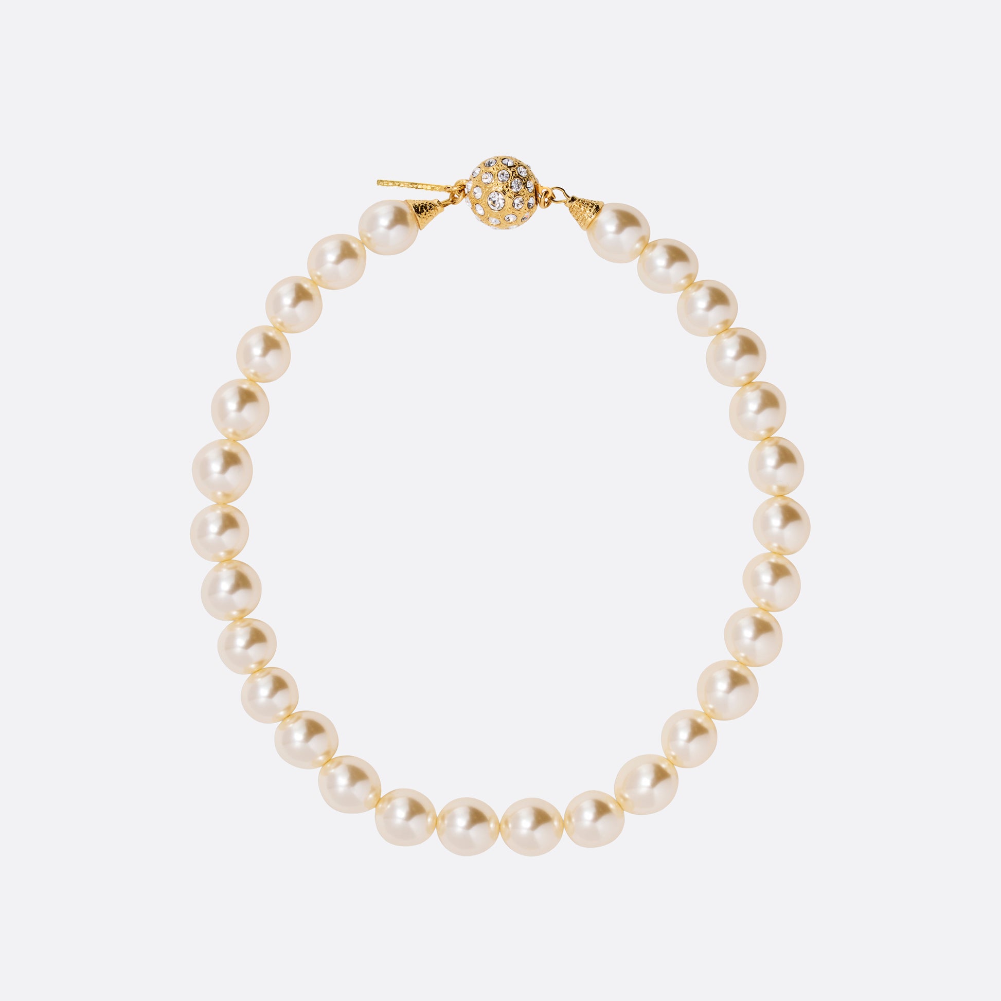 Pearl necklace finished with a crystal-embellished clasp in gold-tone metal.

Featured in the Fall Winter 2026 Lookbook.