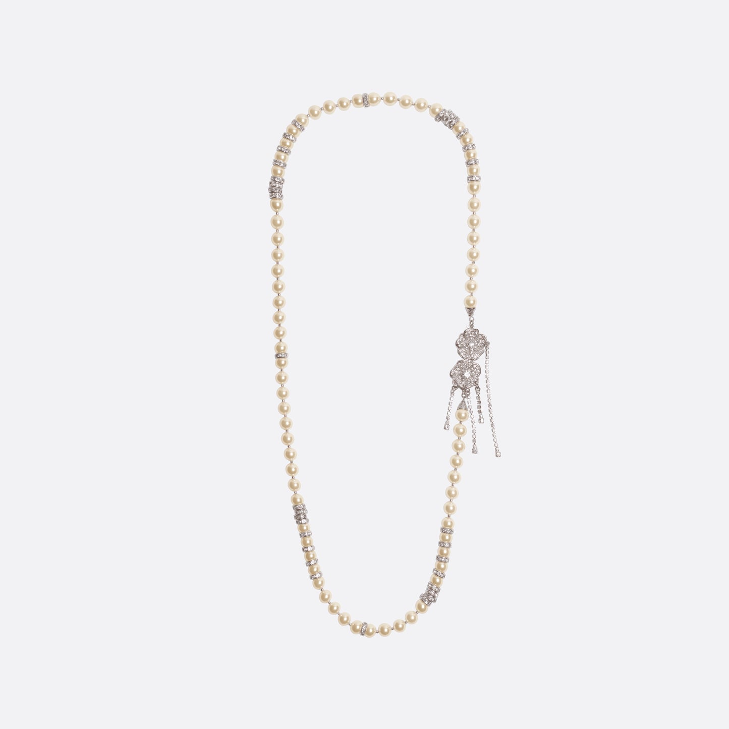 Pearl necklace punctuated with crystal spacer details. Finished with a floral side closure and crystal drop details.

Featured in the Fall Winter 2026 Lookbook.