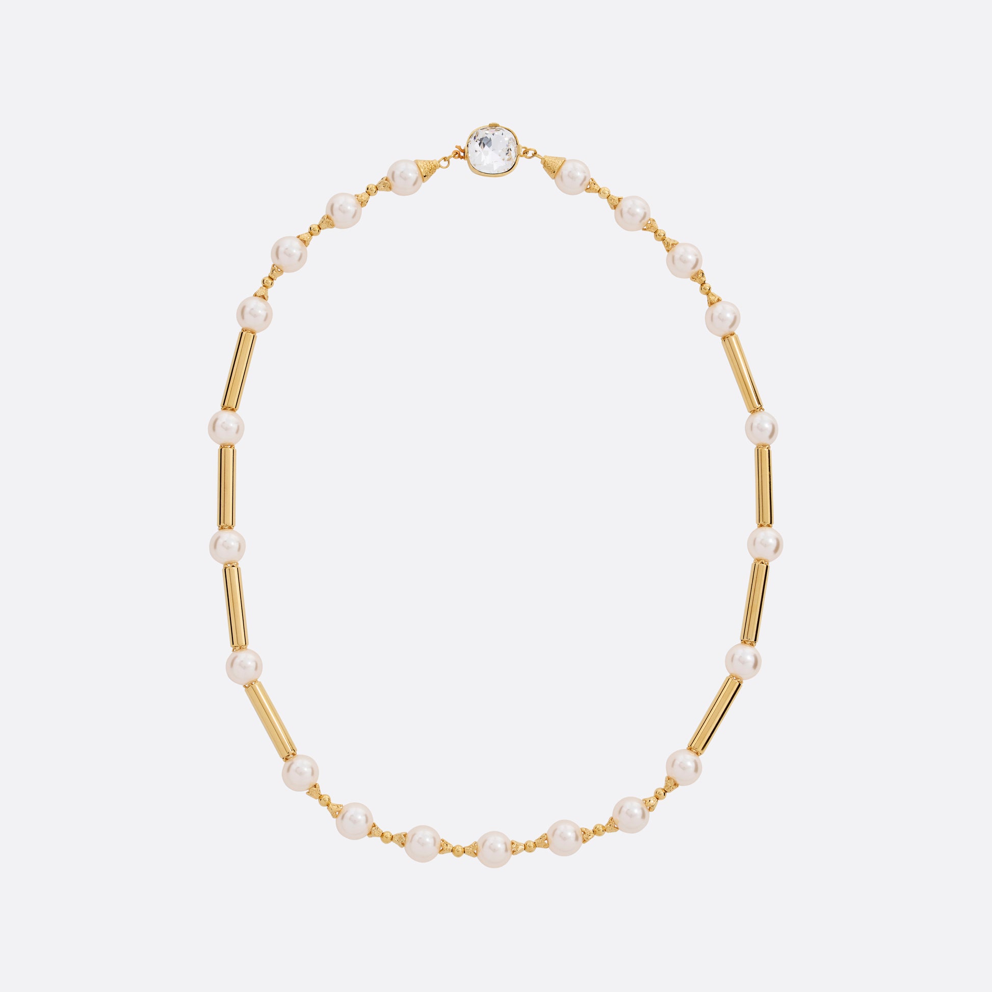 Pearl necklace punctuated by gold-tone metal bar accents. Finished with a crystal detail and clasp fastening.

Featured in the Fall Winter 2026 Lookbook.