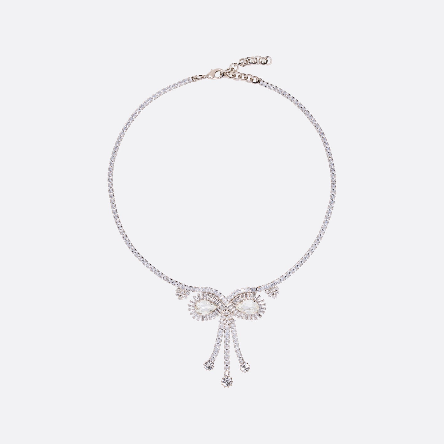Crystal necklace detailed with a bow-shaped embellishment and suspended crystal drops. Finished with an adjustable chain fastening.