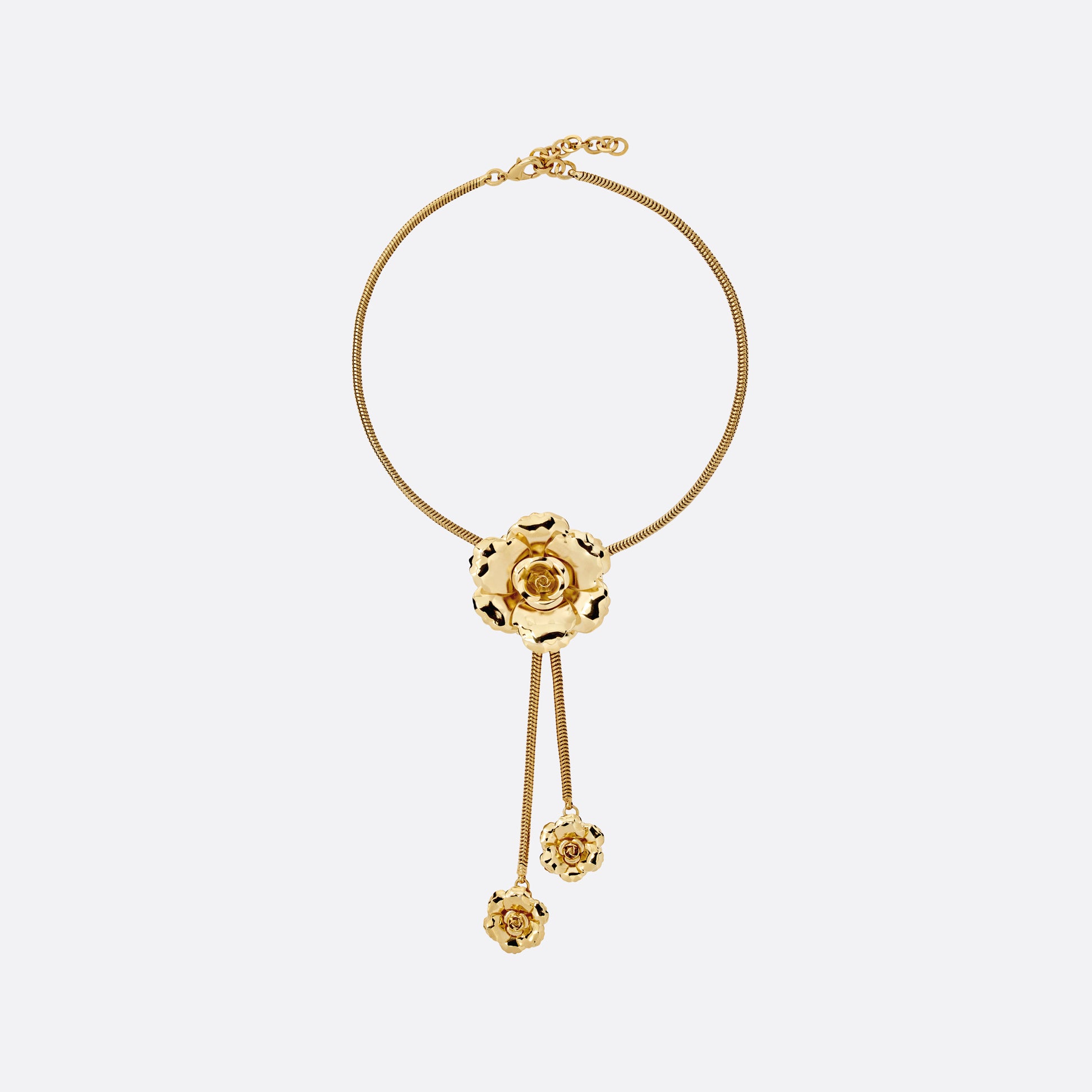 Gold-tone metal necklace centred by a floral motif. Finished with suspended flower charms and an adjustable chain fastening.

Featured in the Fall Winter 2026 Lookbook.