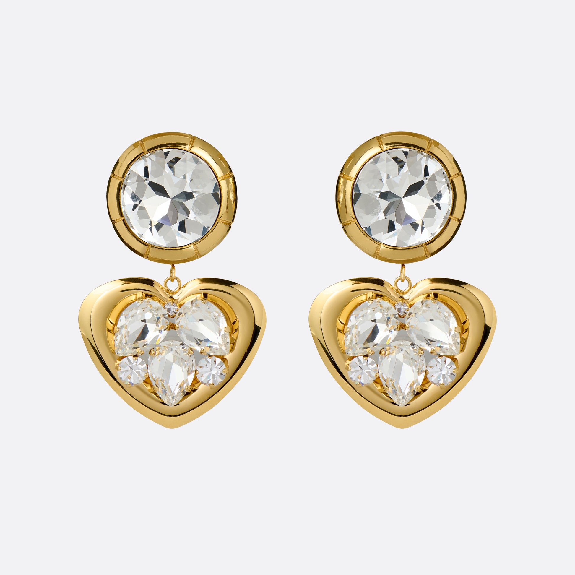 Gold-tone metal clip-on earrings with crystal details and a heart-shaped pendant.

Featured in the Fall Winter 2026 Lookbook.