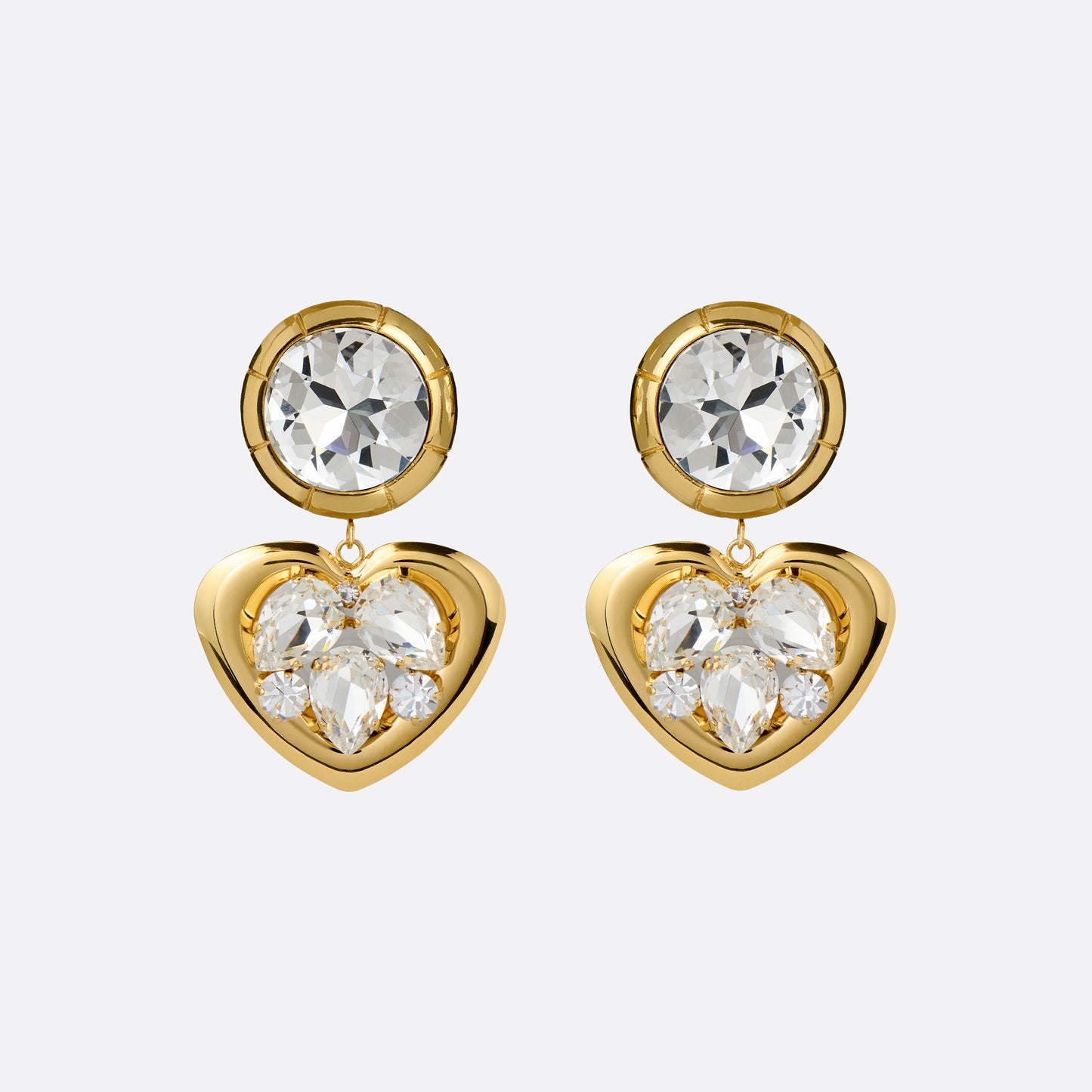 Gold-tone metal clip-on earrings with crystal details and a heart-shaped pendant.

Featured in the Fall Winter 2026 Lookbook.
