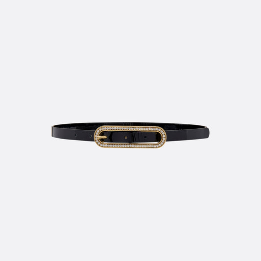 Black slim patent leather belt with oval crystal-embellished buckle.