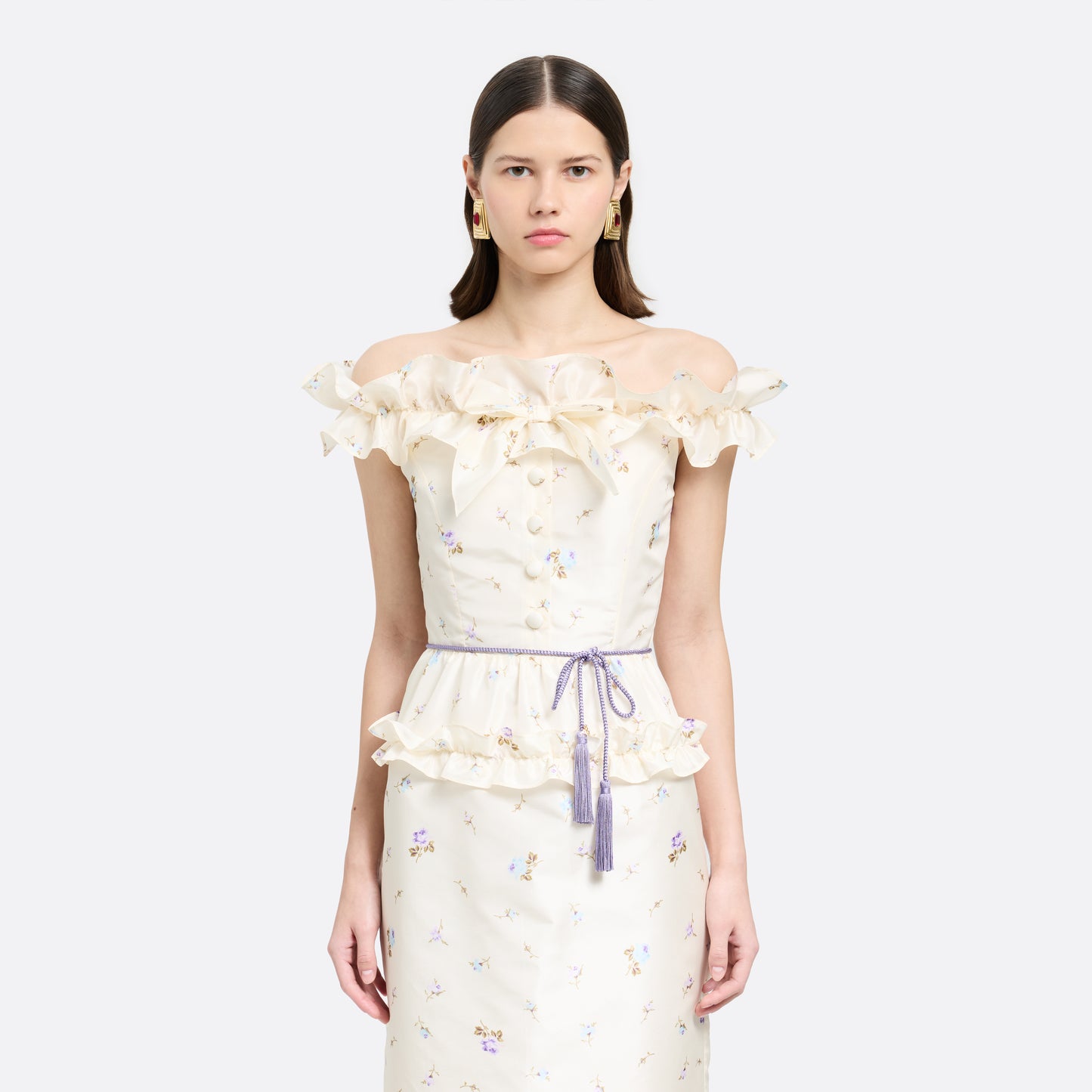 Lilac braided torchon belt with tassels and gold-tone "AR" logo charm.