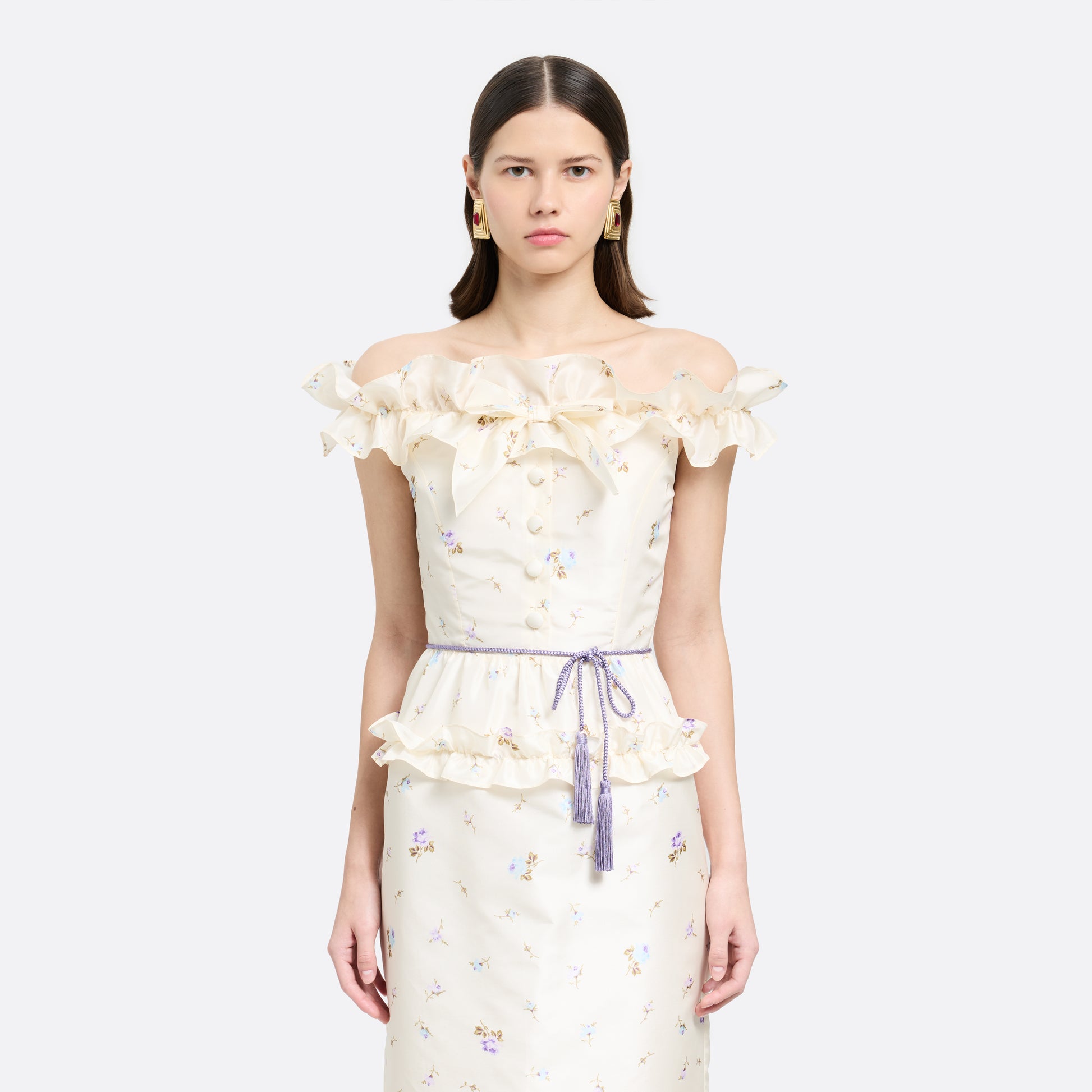 Lilac braided torchon belt with tassels and gold-tone "AR" logo charm.