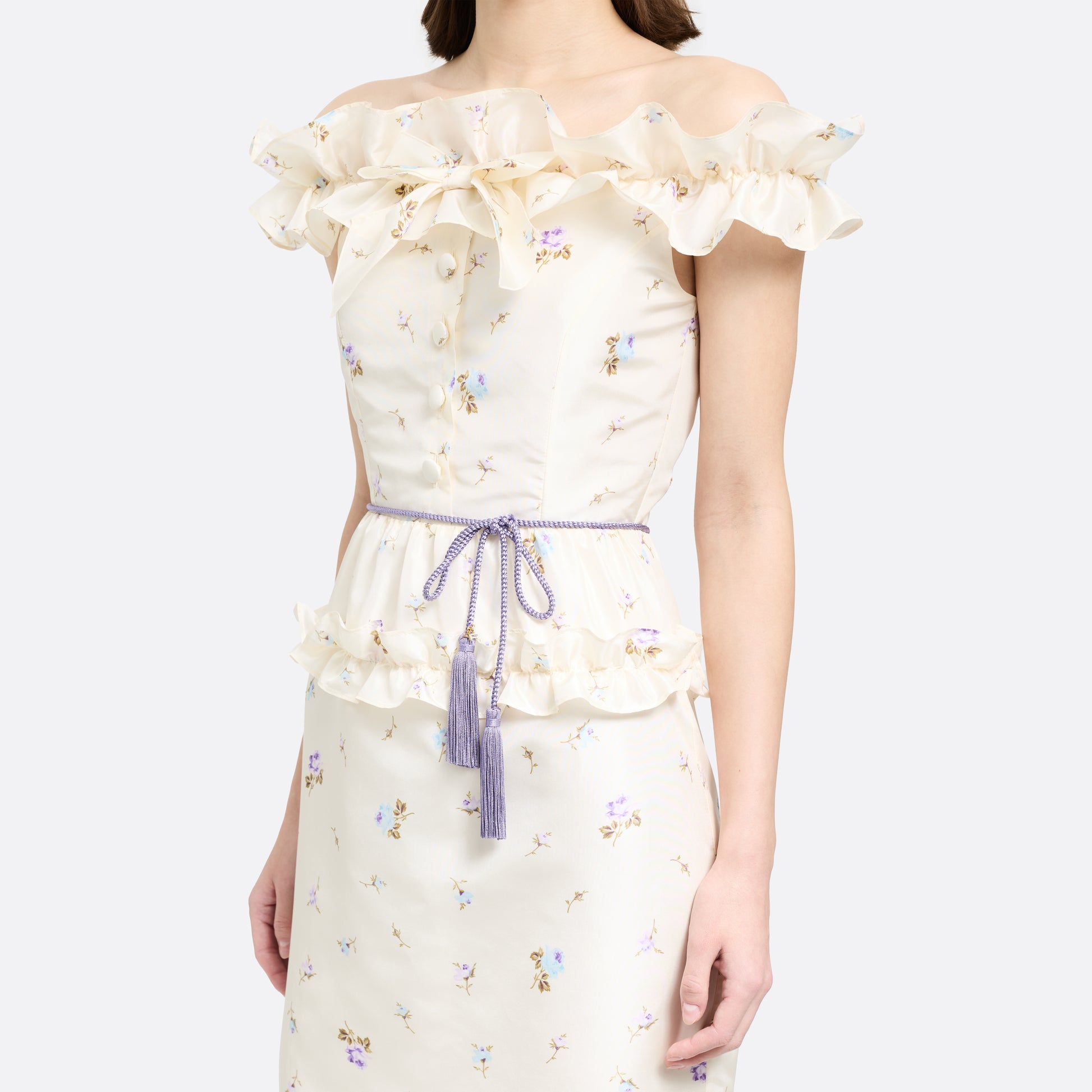 Lilac braided torchon belt with tassels and gold-tone "AR" logo charm.