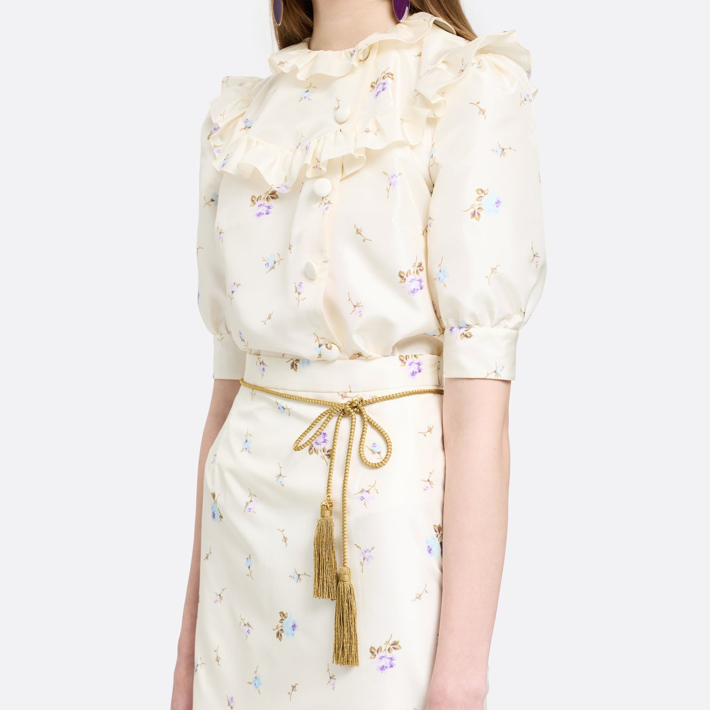 Gold braided torchon belt with tassels and gold-tone "AR" logo charm.