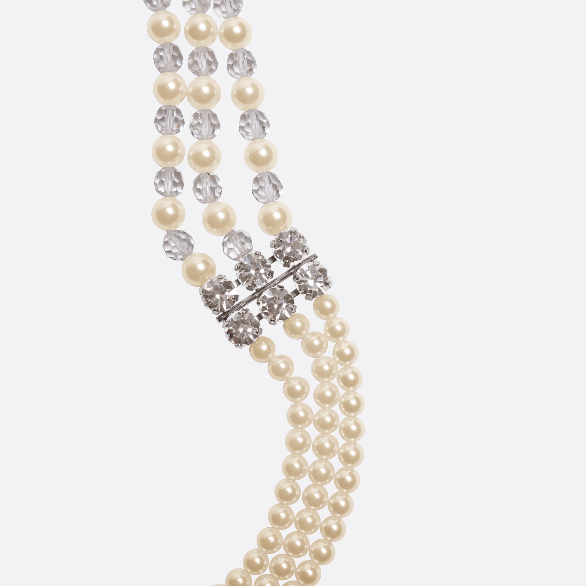 Multi-strand pearl necklace detailed with crystal embellishments and clear bead accents. Finished with a clasp fastening.

Featured in the Fall Winter 2026 Lookbook.