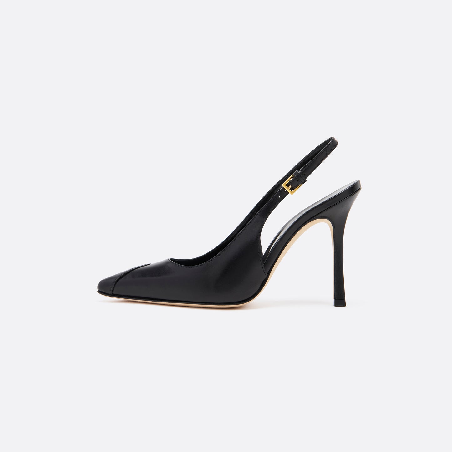 Black leather slingback pumps with a pointed toe detail and a 10.5 cm stiletto heel. Finished with an adjustable strap and a gold-tone buckle.