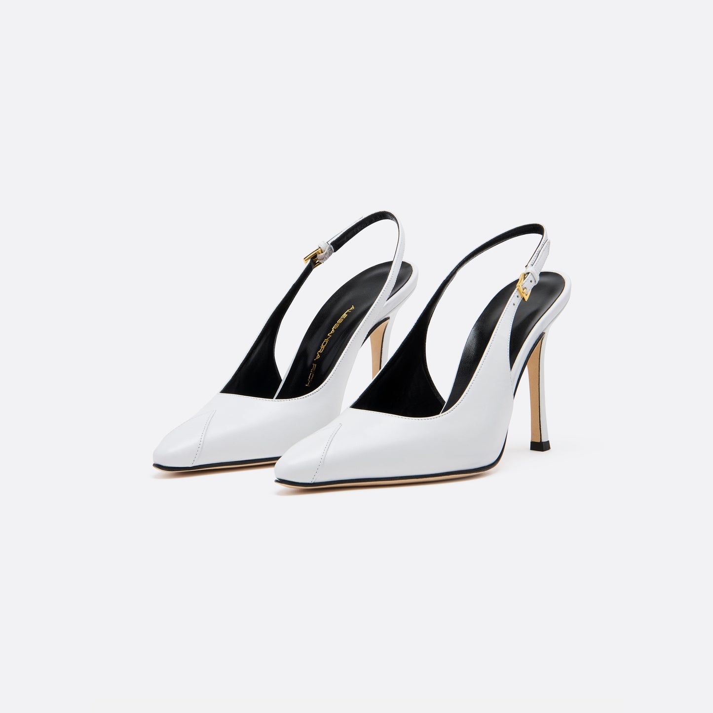 White leather slingback pumps with a pointed toe detail and a 10.5 cm stiletto heel. Finished with an adjustable strap and a gold-tone buckle.