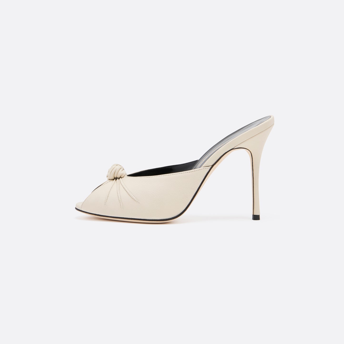 Cream leather mules with a peep toe and a 10.5 cm stiletto heel. Finished with a central knot detail.