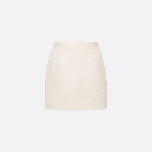 Ivory tweed bouclé mini skirt with a high waist and a fitted silhouette.