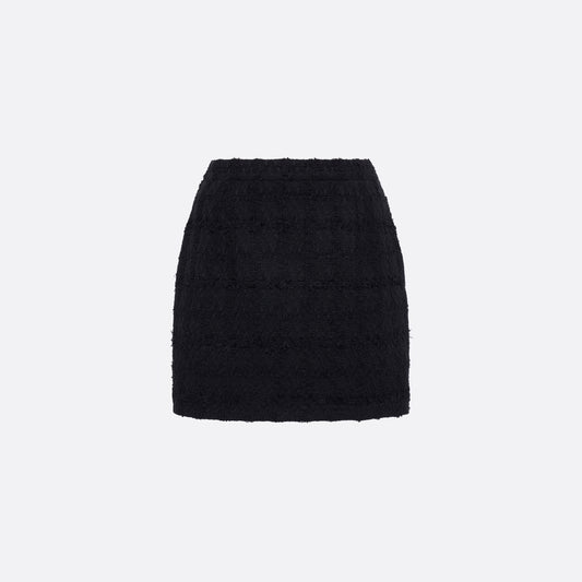 Black check tweed bouclé mini skirt with a high waist and a fitted silhouette.