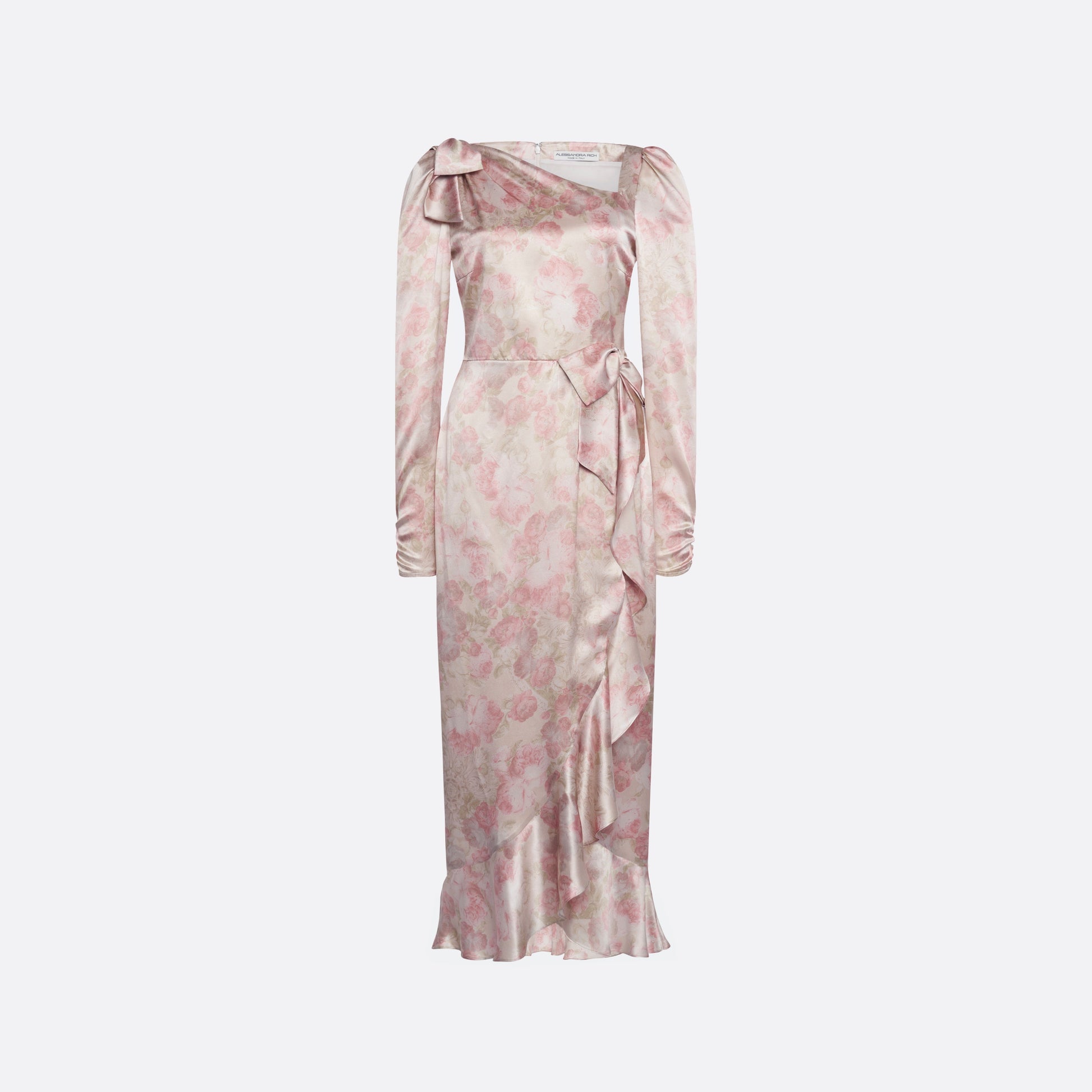 Pale pink floral print silk satin midi dress with long sleeves and draped slit, featuring volant detail and bows.