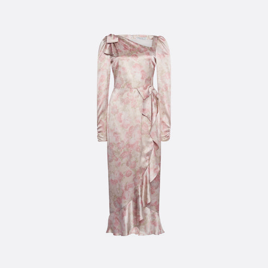 Pale pink floral print silk satin midi dress with long sleeves and draped slit, featuring volant detail and bows.