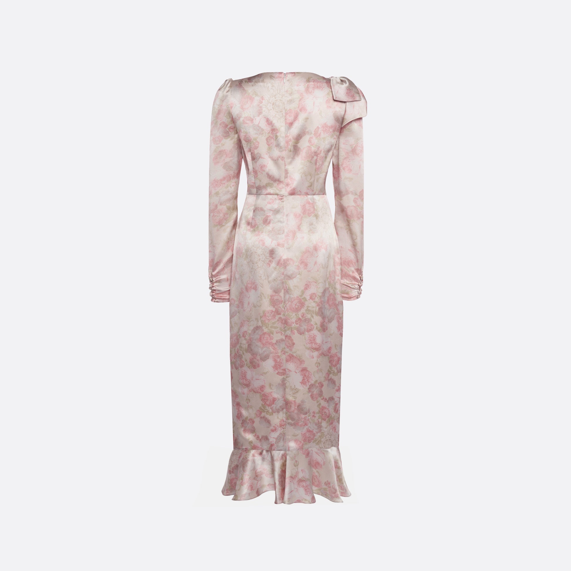 Pale pink floral print silk satin midi dress with long sleeves and draped slit, featuring volant detail and bows.