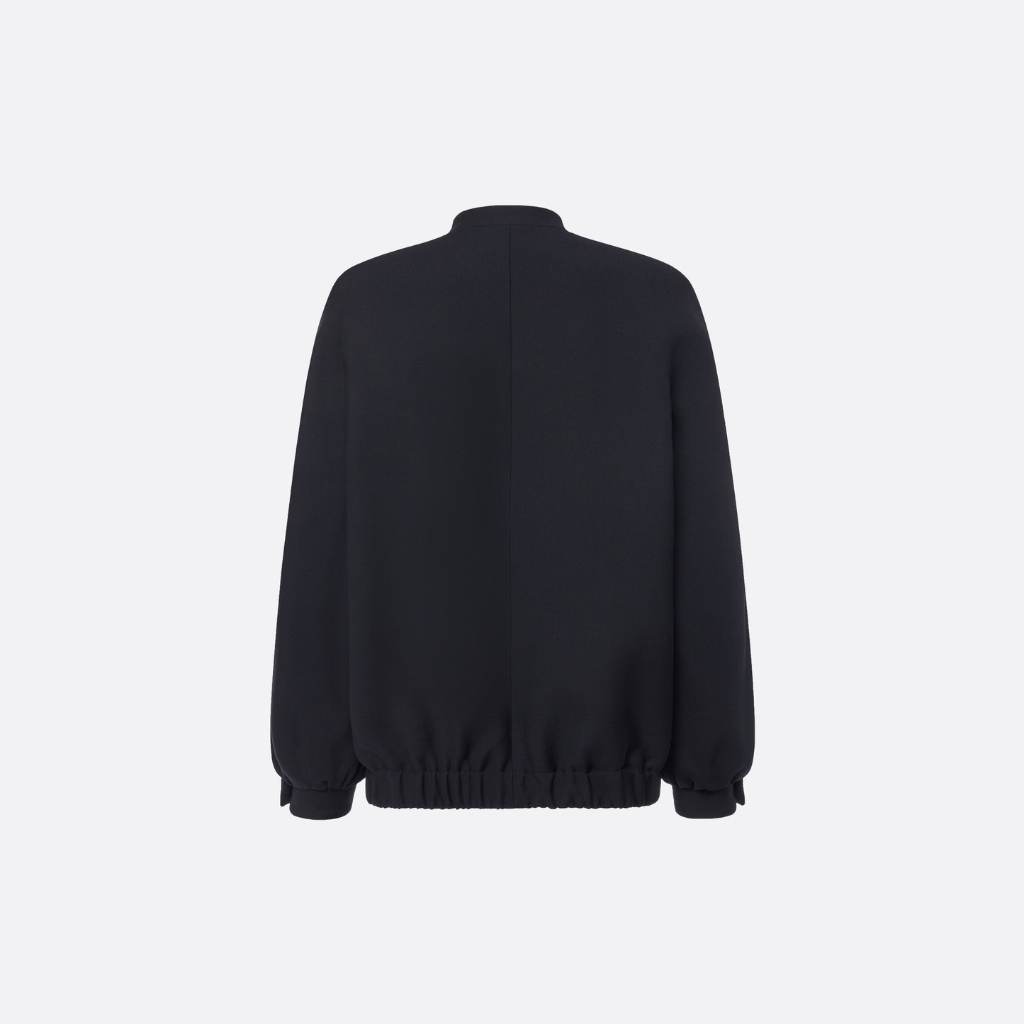 Oversized black wool blouson with a high neckline and long slevees, featuring jewel buttons.