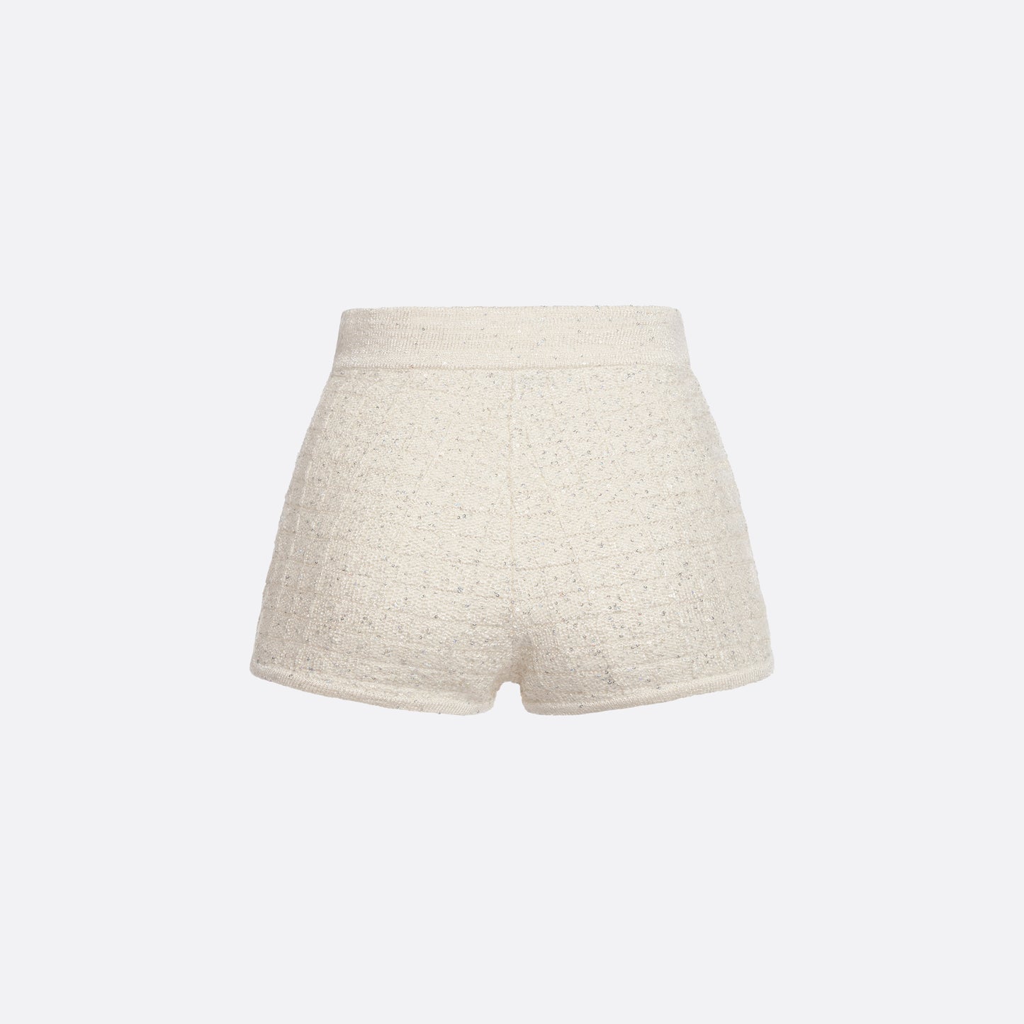 White high-waisted wool sequin knit shorts with jewel buttons.