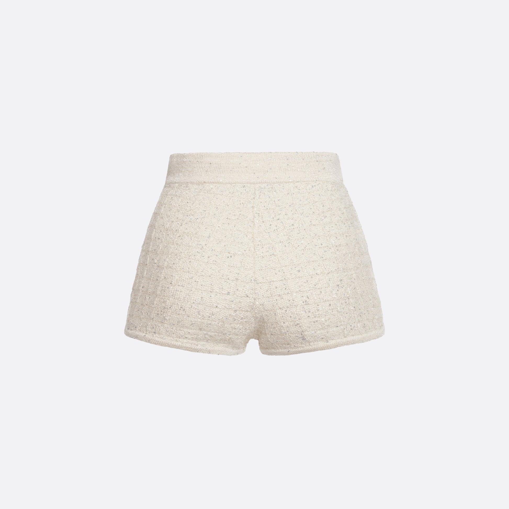 White high-waisted wool sequin knit shorts with jewel buttons.