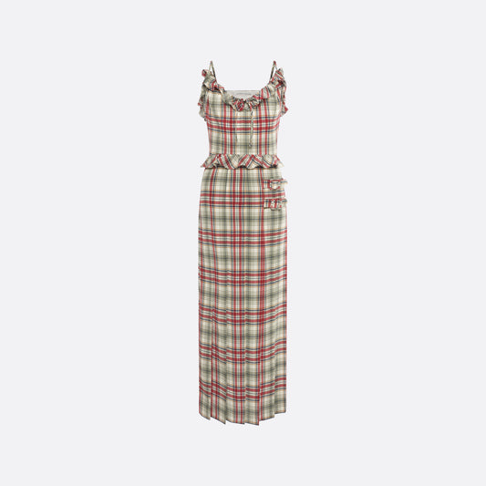 Red and green tartan-print silk crêpe de chine midi dress with spaghetti straps and a ruffled scoop neckline. The silhouette is finished with a pleated skirt with side split, a ruffled waist and buckles.