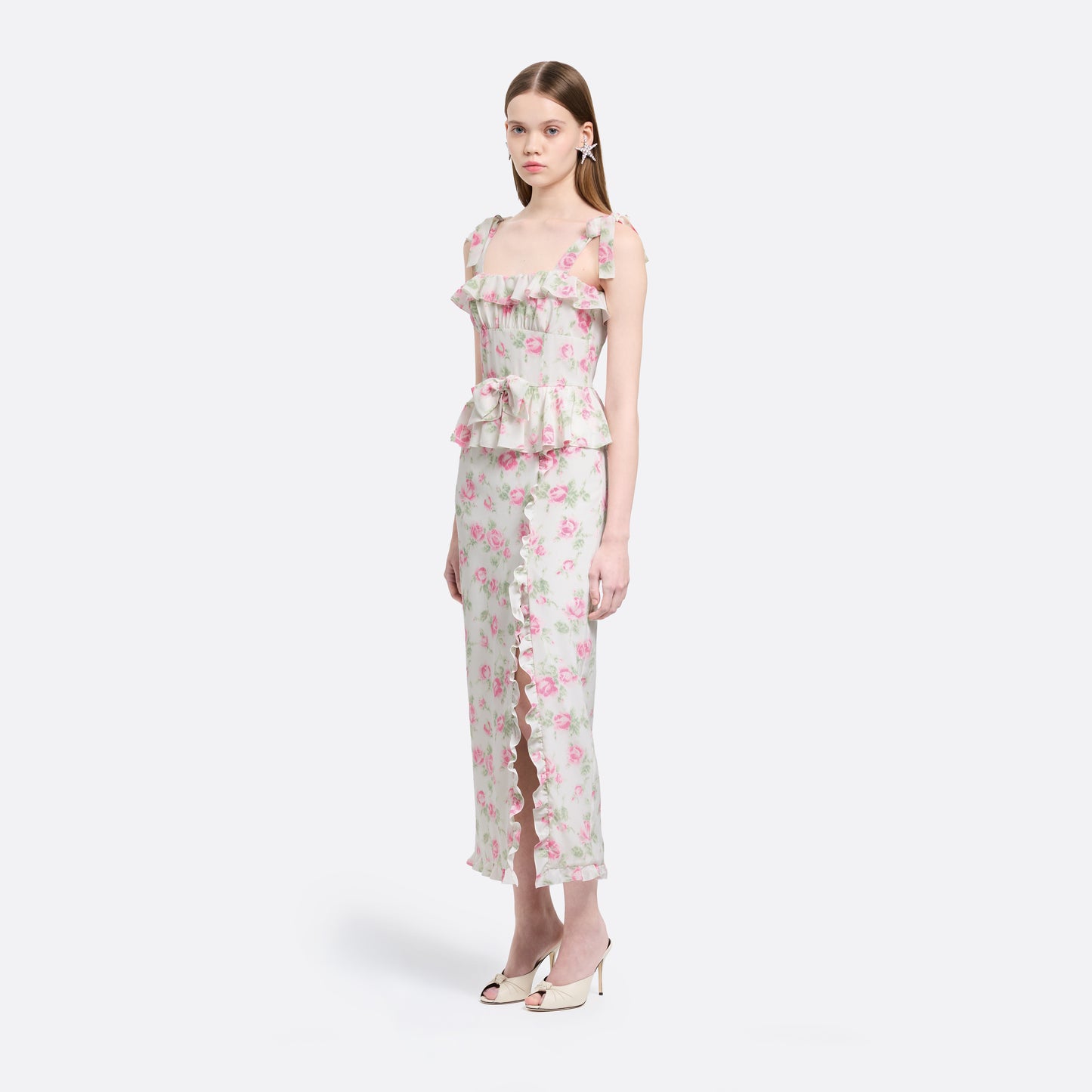 Pink and white floral-print silk crêpe de chine midi dress with self-tie shoulder straps and a ruffled neckline. A peplum defines the silhouette, while the straight skirt is finished with delicate ruffle trim.