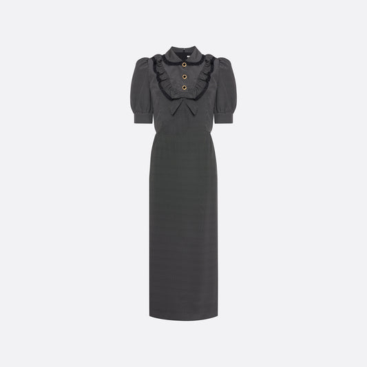 Black and white small polka-dot print silk crêpe de chine midi dress with short puffed sleeves and black and old tone buttons. Finished with a lace trimmed collar and ruffled bib detailing.

Look 31 – Fall Winter 2026 Lookbook