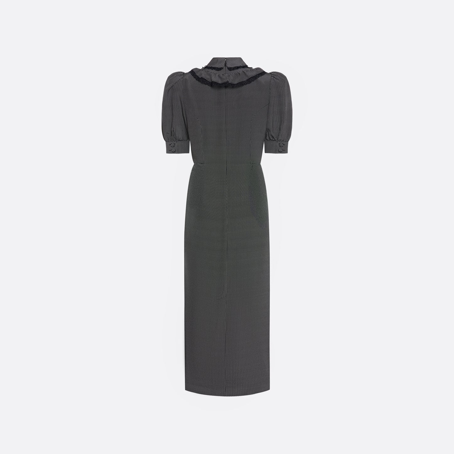 Black and white small polka-dot print silk crêpe de chine midi dress with short puffed sleeeves and black and old tone buttons. Finished with a lace trimmed collar and ruffled bib detailing.

Look 31 – Fall Winter 2026 Lookbook.