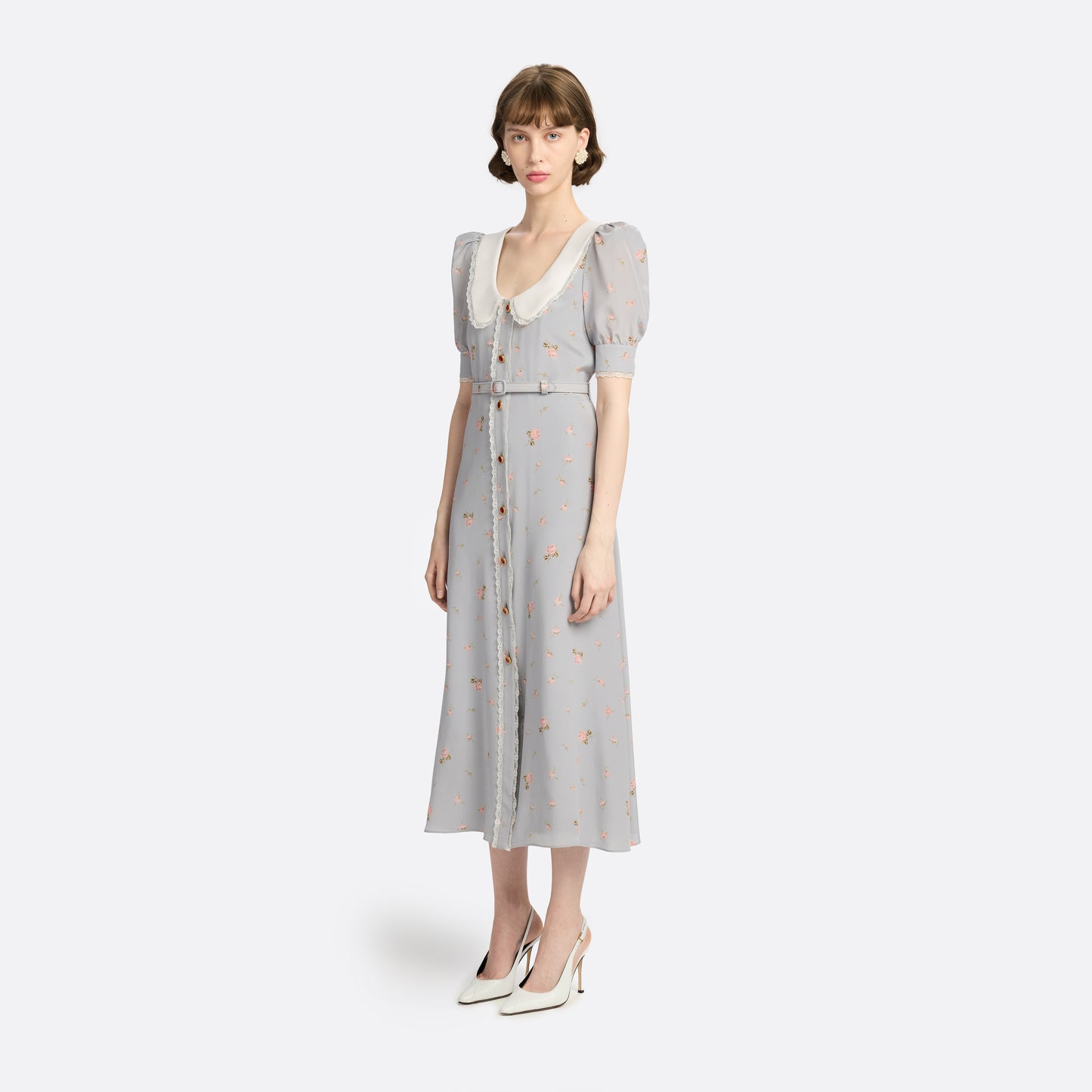 Pearl-grey and pink floral-print silk crêpe de chine midi dress with a front button closure, a rounded collar framed by lace trim and short puff sleeves. Finished with red and gold-tone buttons and a slim belt.