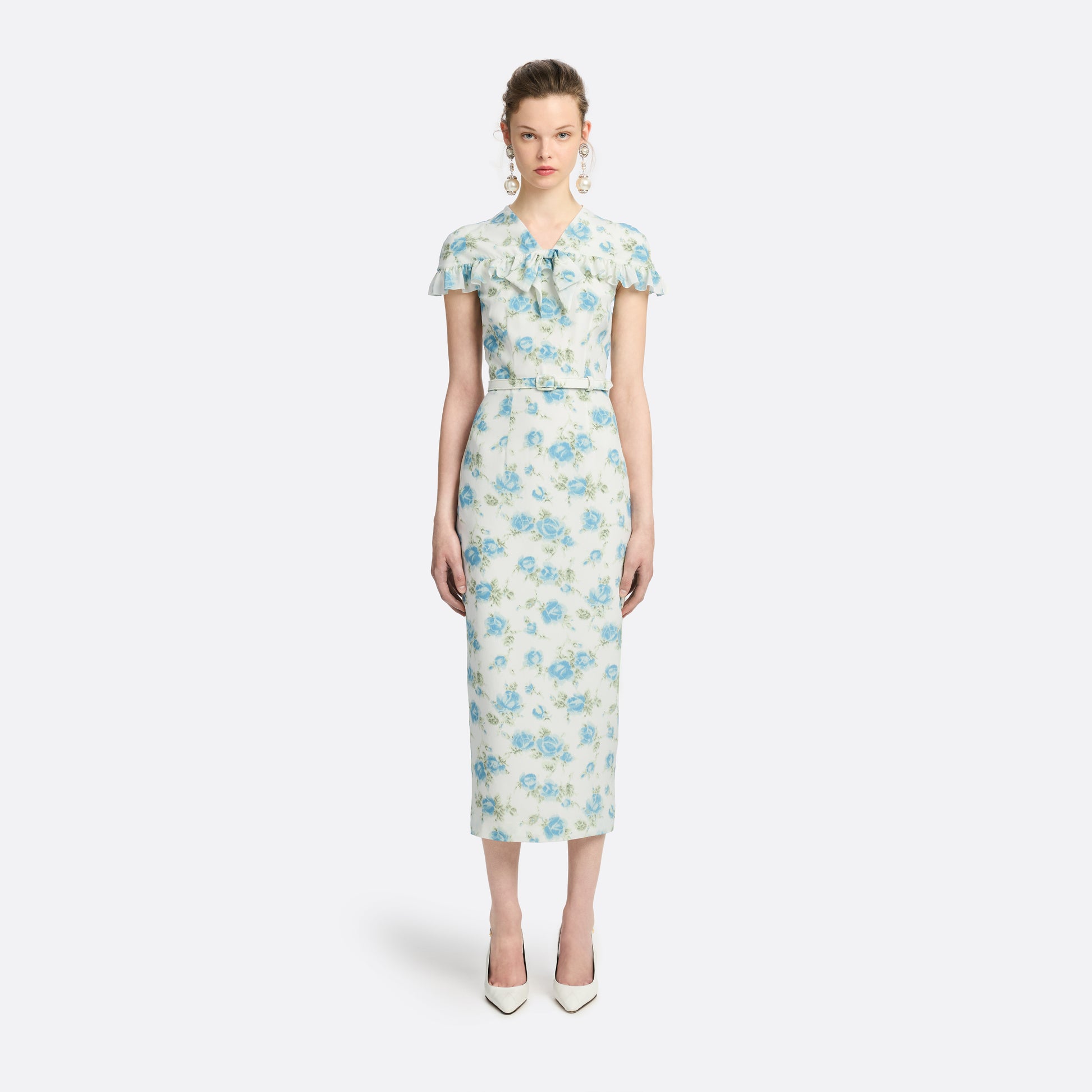 Light blue and white floral-print silk crêpe de chine midi dress with a high neckline and bow detail. With a fitted silhouette, it is finished with ruffle-trimmed short sleeves and a slim belt.

Look 14 – Fall Winter 2026 Lookbook.