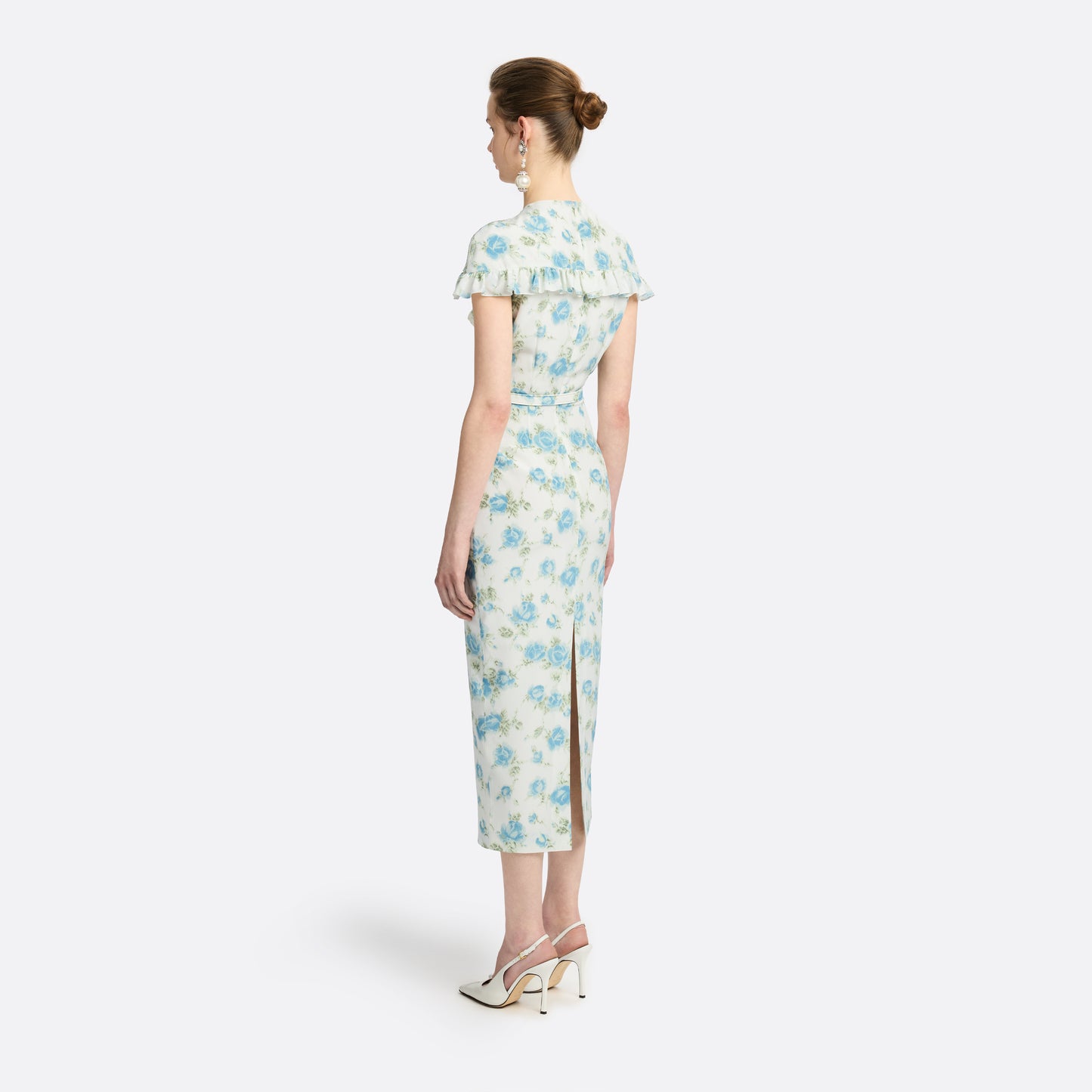 Light blue and white floral-print silk crêpe de chine midi dress with a high neckline and bow detail. With a fitted silhouette, it is finished with ruffle-trimmed short sleeves and a slim belt.

Look 14 – Fall Winter 2026 Lookbook.