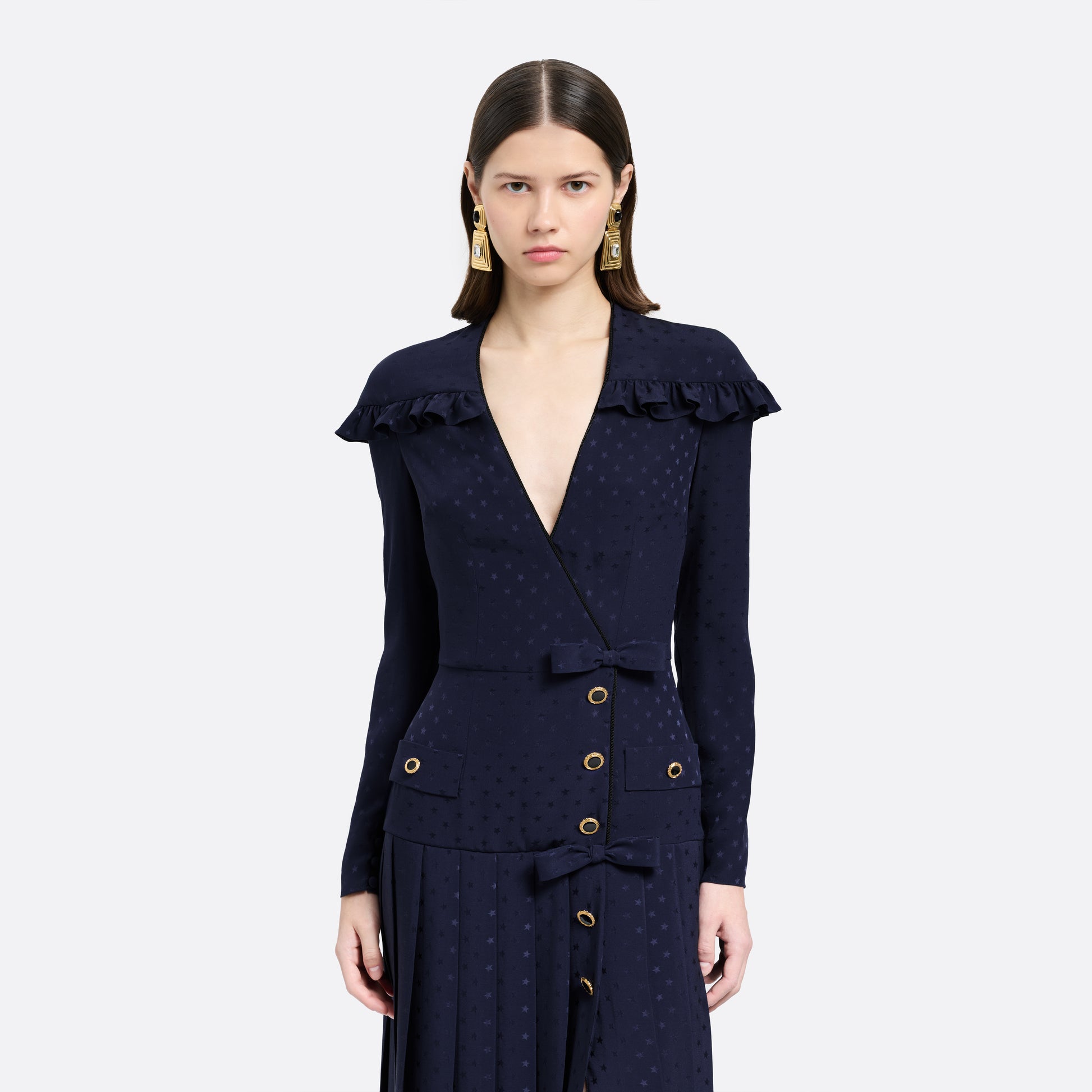 Navy blue star-jacquard silk midi dress with a wrap-effect V-neckline detailed with a ruffled trim and long sleeves. Finished with black and gold-tone buttons, bows at the waist and a pleated skirt with a front split.