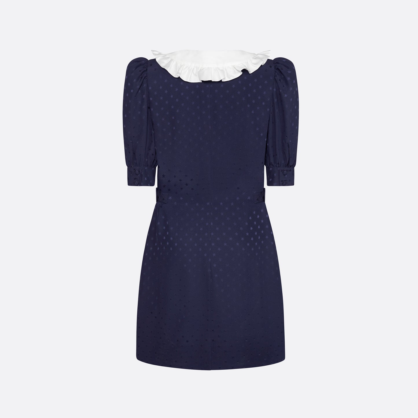 Navy blue star-jacquard silk mini dress with a front button closure, contrasting ruffled collar and puff sleeves. Finished black and gold-tone buttons, side buckles and pockets.

Look 15 – Fall Winter 2026 Lookbook.