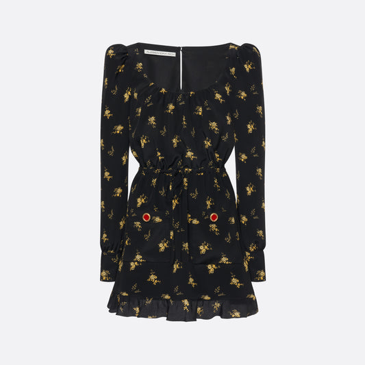 Black and yellow floral-print silk crêpe de chine mini dress with a scooped neckline and long sleeves. Defined by a drawstring waist, the silhouette is finished with patch pockets, jewel buttons and a volant hem.