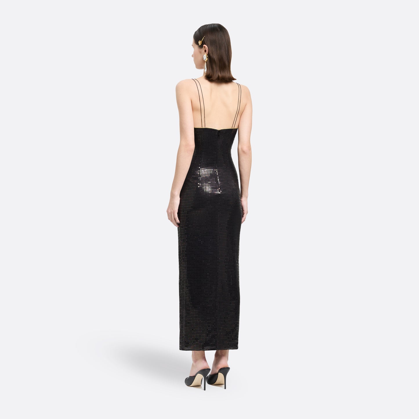 Black sequin-embroidered stretch silk georgette sleeveless dress cut to a fitted silhouette with a v-neckline. Finished with gold-tone bow details and side split.

Look 25 – Fall Winter 2026 Lookbook