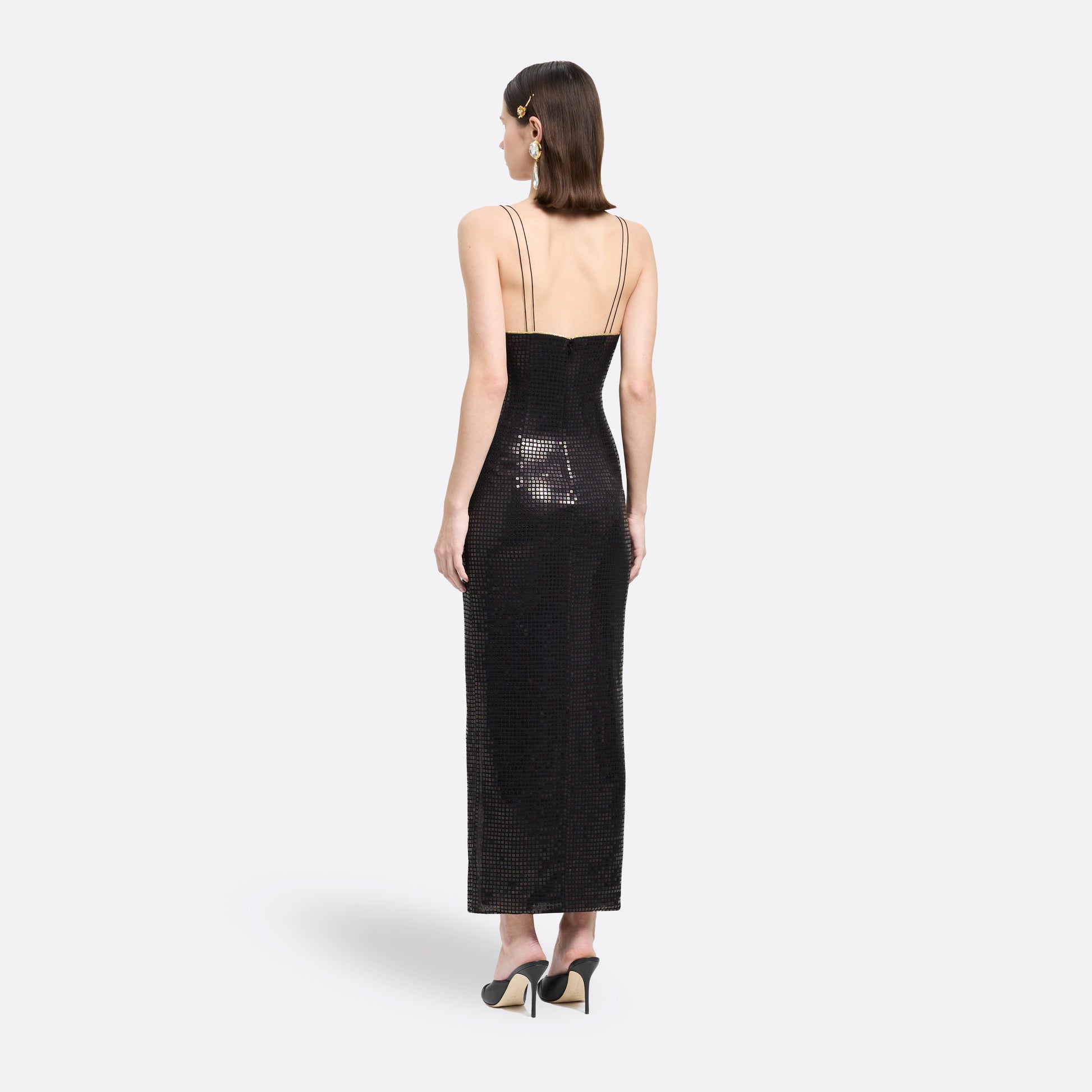 Black sequin-embroidered stretch silk georgette sleeveless dress cut to a fitted silhouette with a v-neckline. Finished with gold-tone bow details and side split.

Look 25 – Fall Winter 2026 Lookbook
