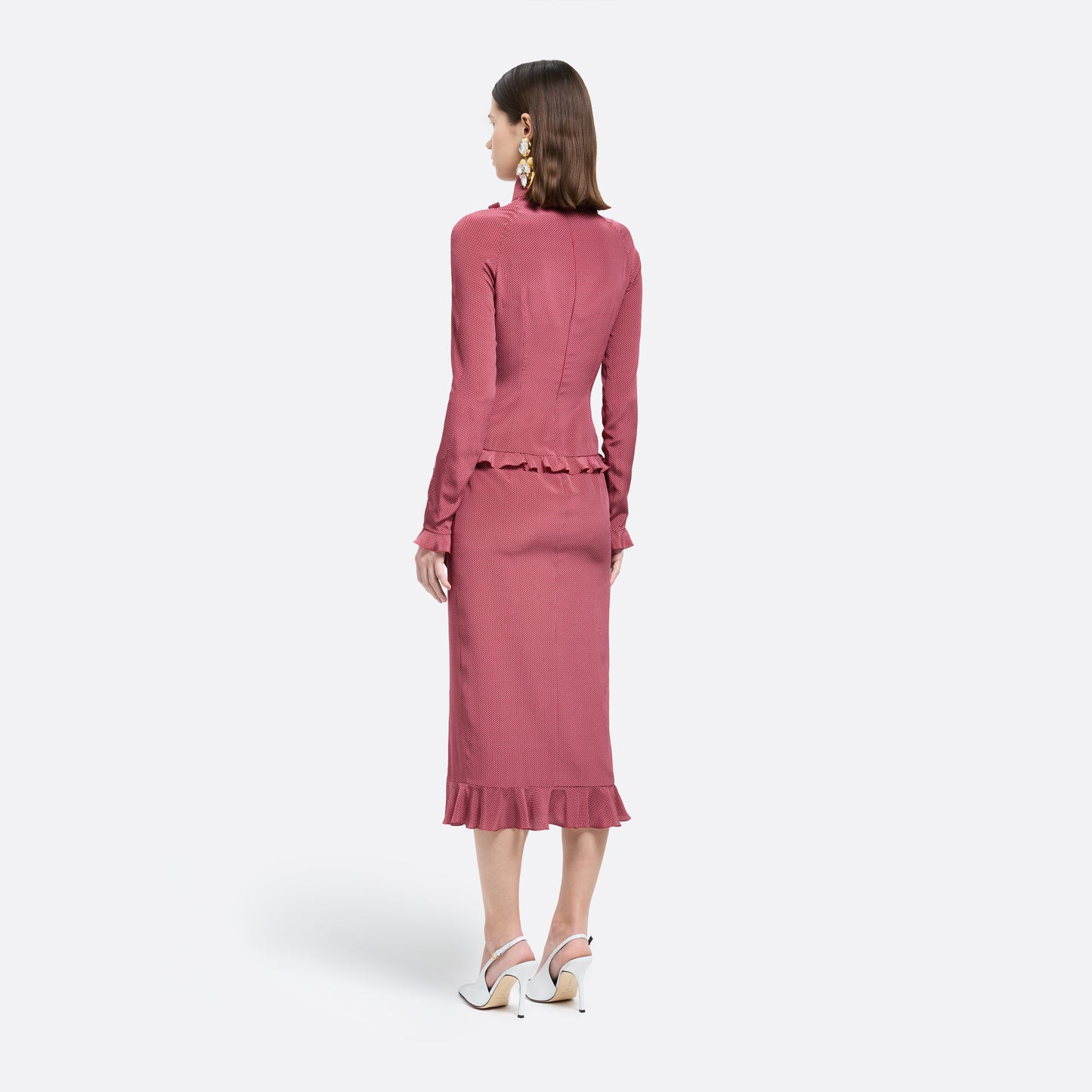 Bordeaux and white small polka-dot print silk crêpe de chine midi dress cut to a fitted silhouette with a high neckline and long sleeves. Finished with ruffled trims and bows.

Look 1 – Fall Winter 2026 Lookbook.
