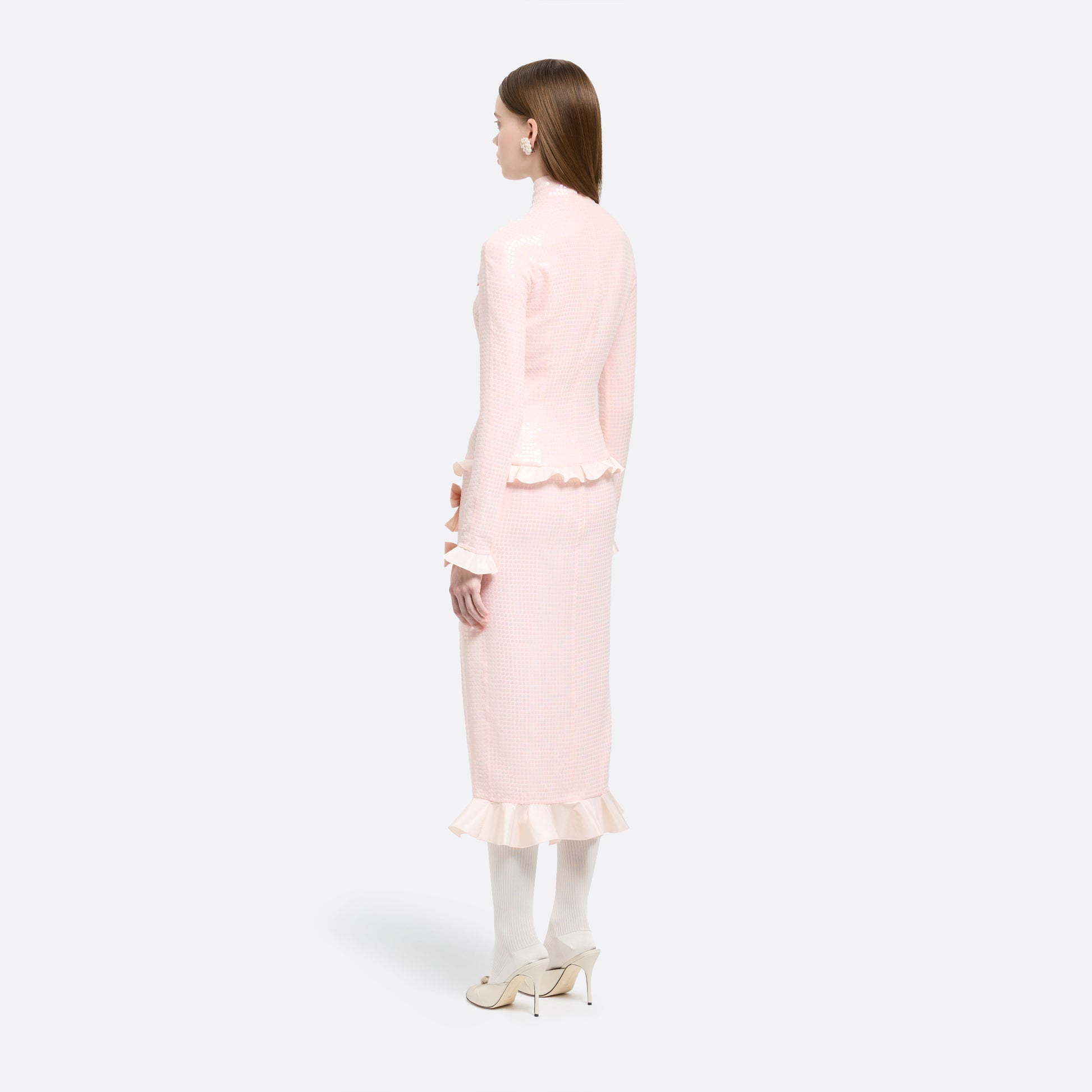 Pink sequin-embroidered stretch silk georgette midi dress cut to a fitted silhouette with a high neckline and long sleeves. Finished with ruffled trims and bows.

Look 27 – Fall Winter 2026 Lookbook.
